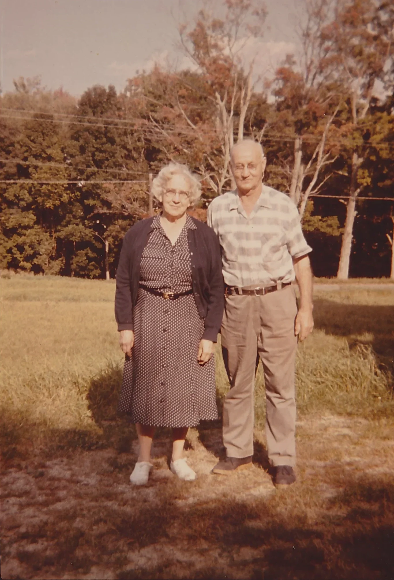 Nellie and Bert Fortier, previous owners of the property, standing outside the historic farmhouse in Chocorua, New Hampshire.