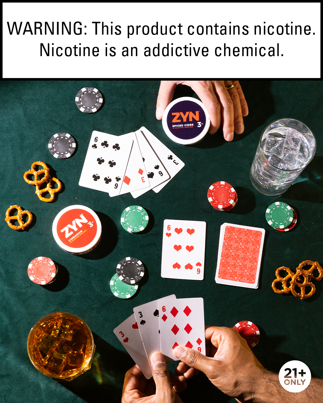 A poker game setup on a green table with playing cards, poker chips, pretzels, a glass of whiskey, a glass of water with ice, and nicotine products including ZYN nicotine pouches and a glass of whiskey. The top of the image has a warning about nicotine. The image is marked for 21+ only.