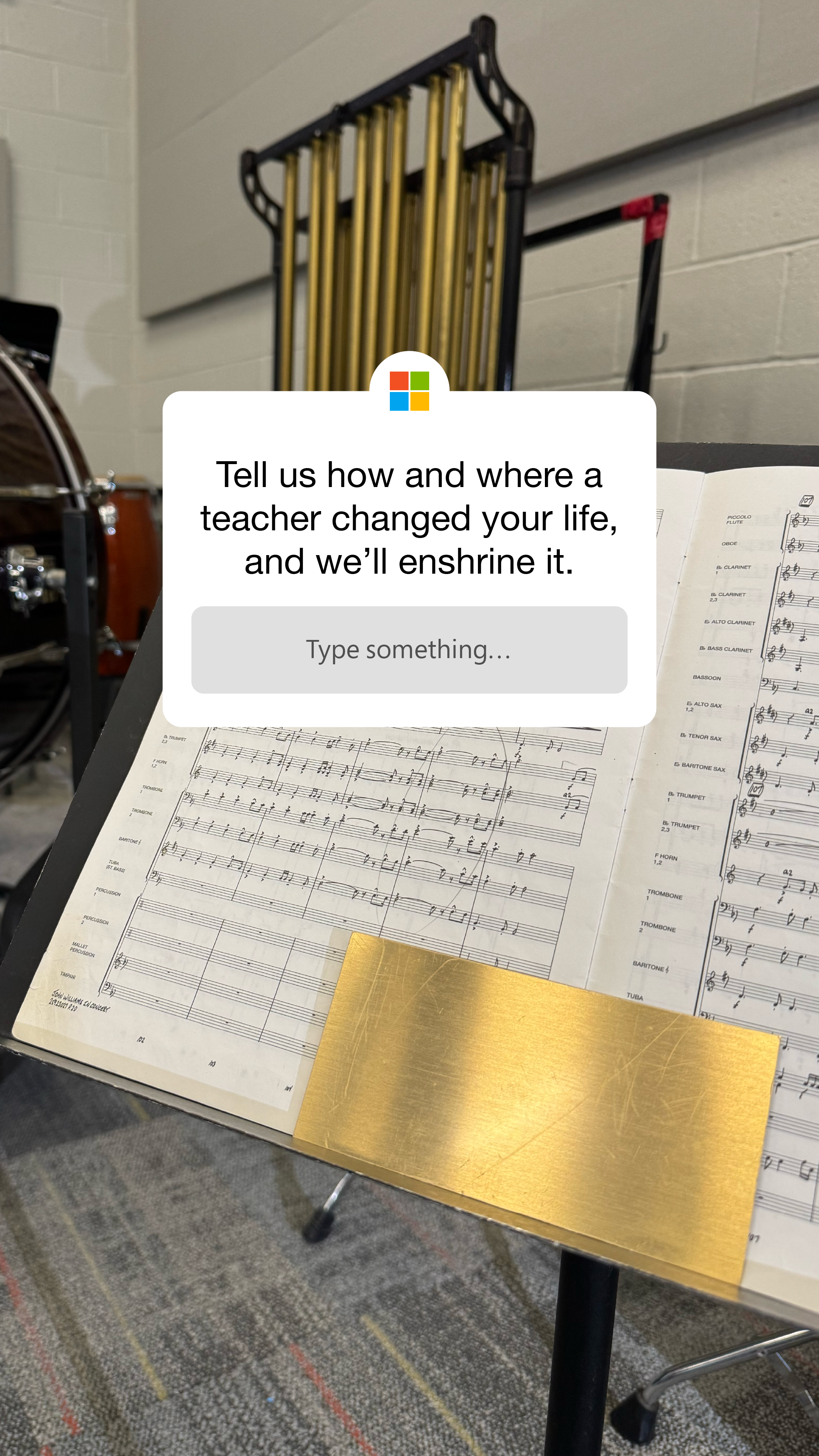 Music stand holding sheet music in a room with a music instrument in the background.