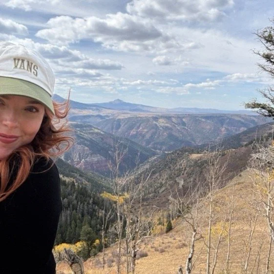 Girl smiling on a mountain