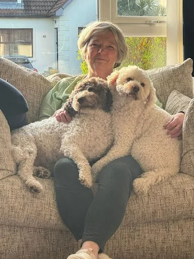 Artist Deirdre P. Malcolm at home with her dogs