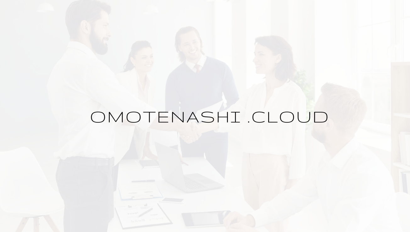 Business team shaking hands in a meeting room with colleagues.