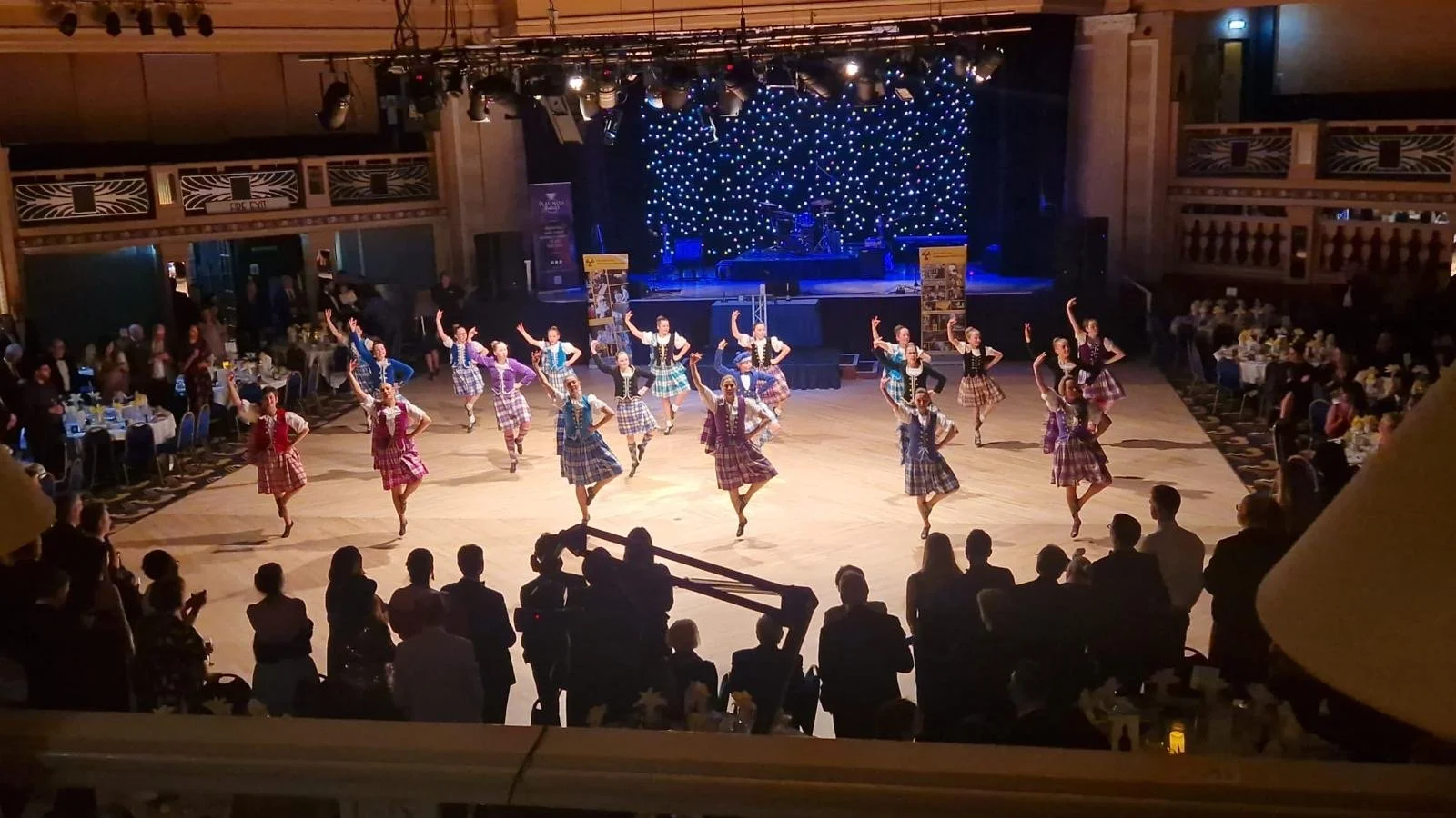 Showcasing traditional Highland dancing at a charity event in Aberdeen.