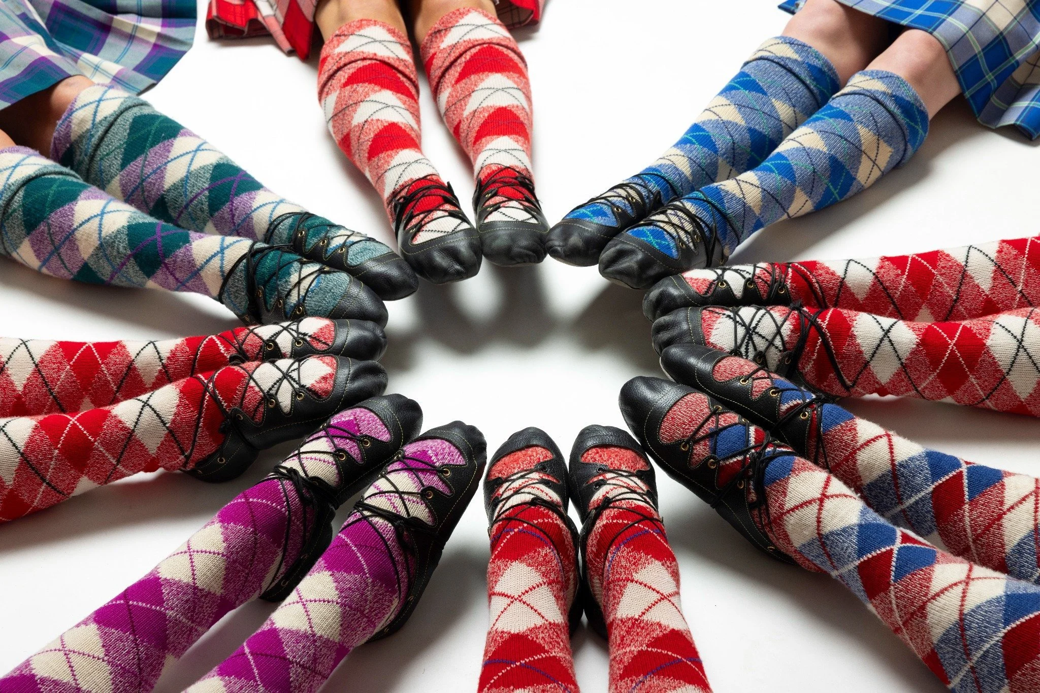 Pairs of Highland dance shoes and argyle socks in a circle; Pam Dignan Highland Dancers — classes for all ages in Westhill