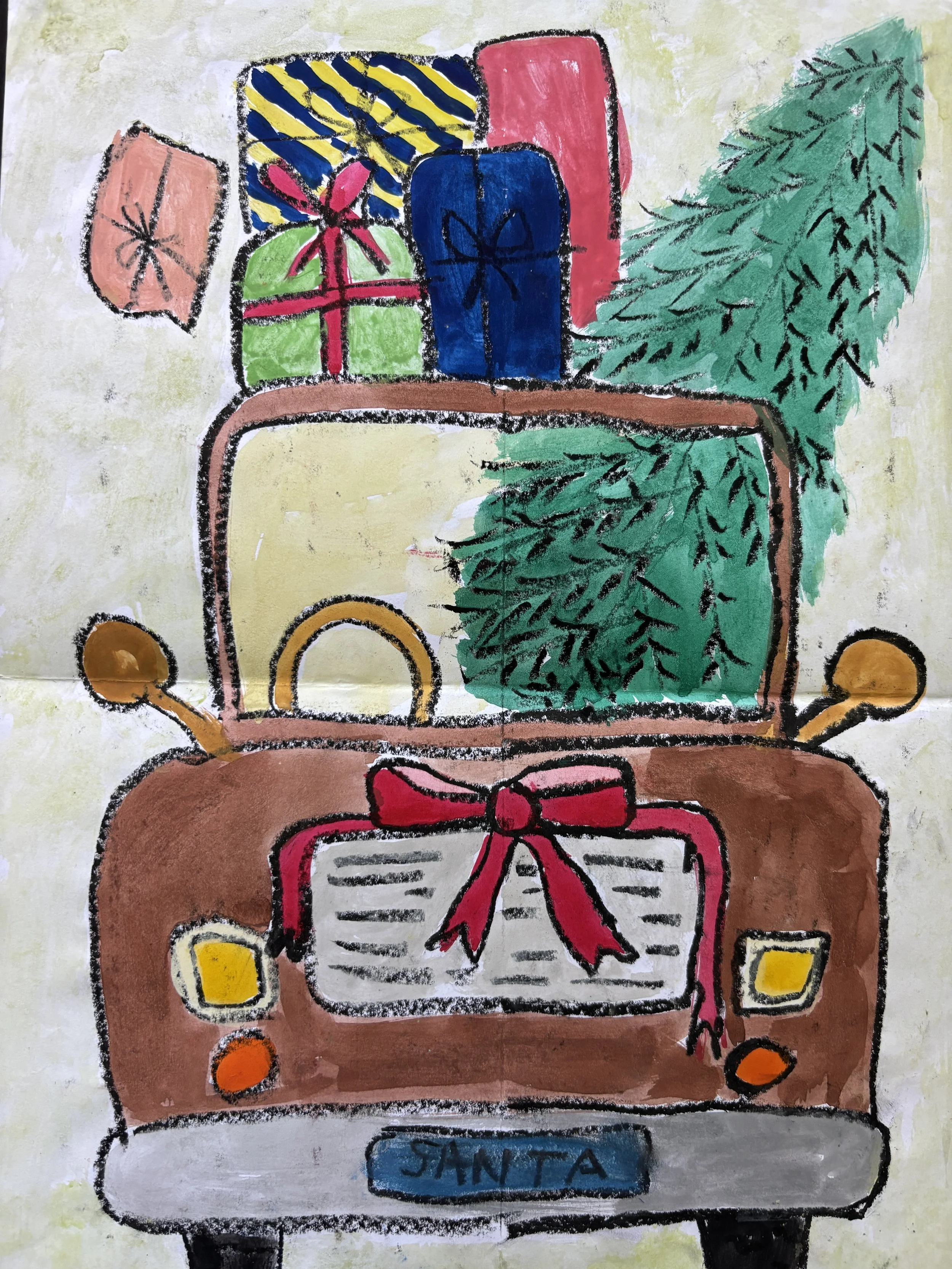 Colorful childlike drawing of a decorated vehicle with a Christmas theme, featuring gifts on top, a decorated tree on the side, and a large red bow on the front, with the word "Santa" on the license plate.