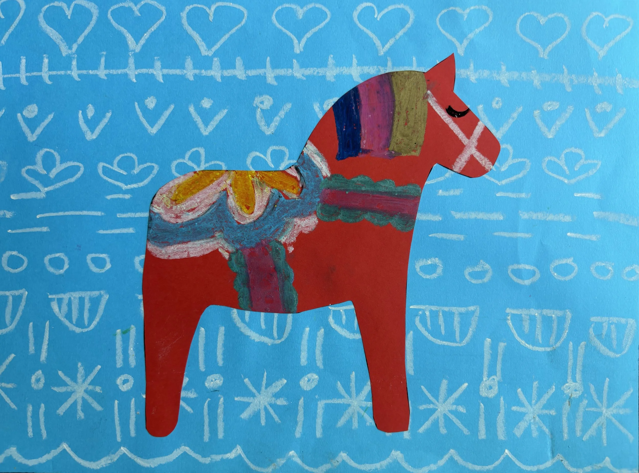 Child's drawing of a large red horse on a blue background with white hearts and geometric patterns.