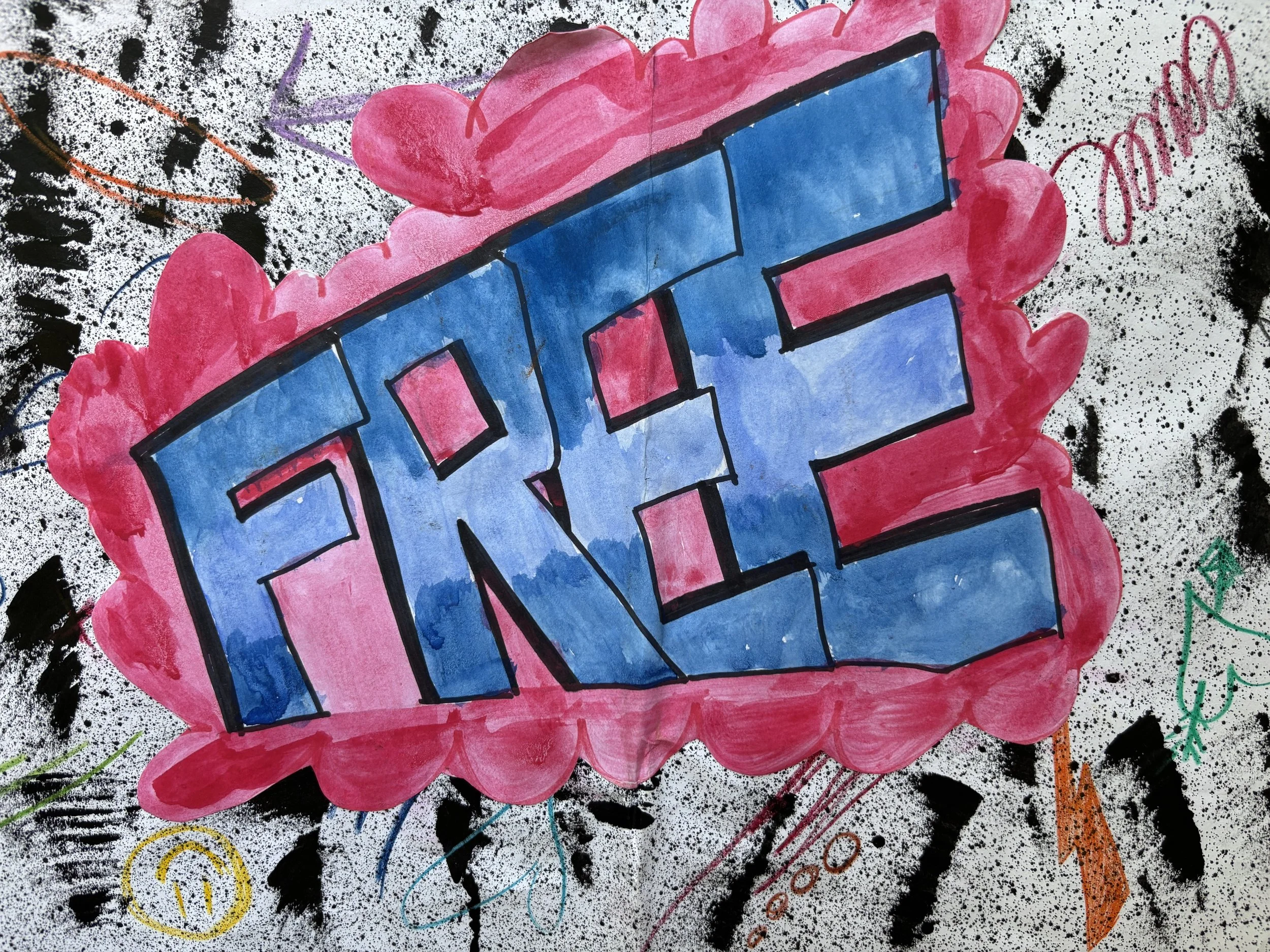 Colorful graffiti art with the word "FANG" in bold blue letters outlined in black, surrounded by pink cloud-like background, on a black and white splattered wall with additional doodles and tags.