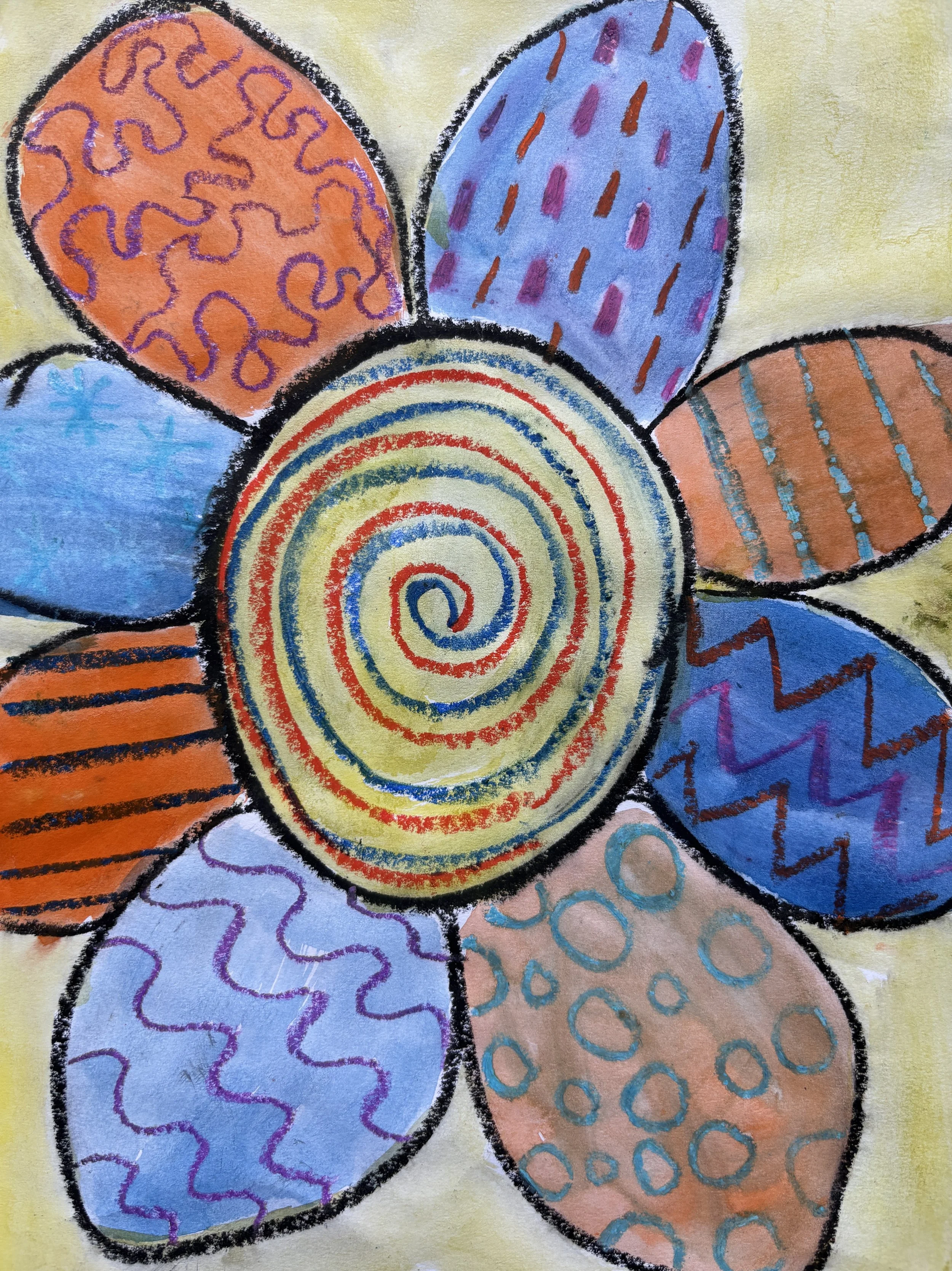 Colorful drawing of a flower with six petals, each petal decorated with different patterns and colors, surrounding a spiral center.