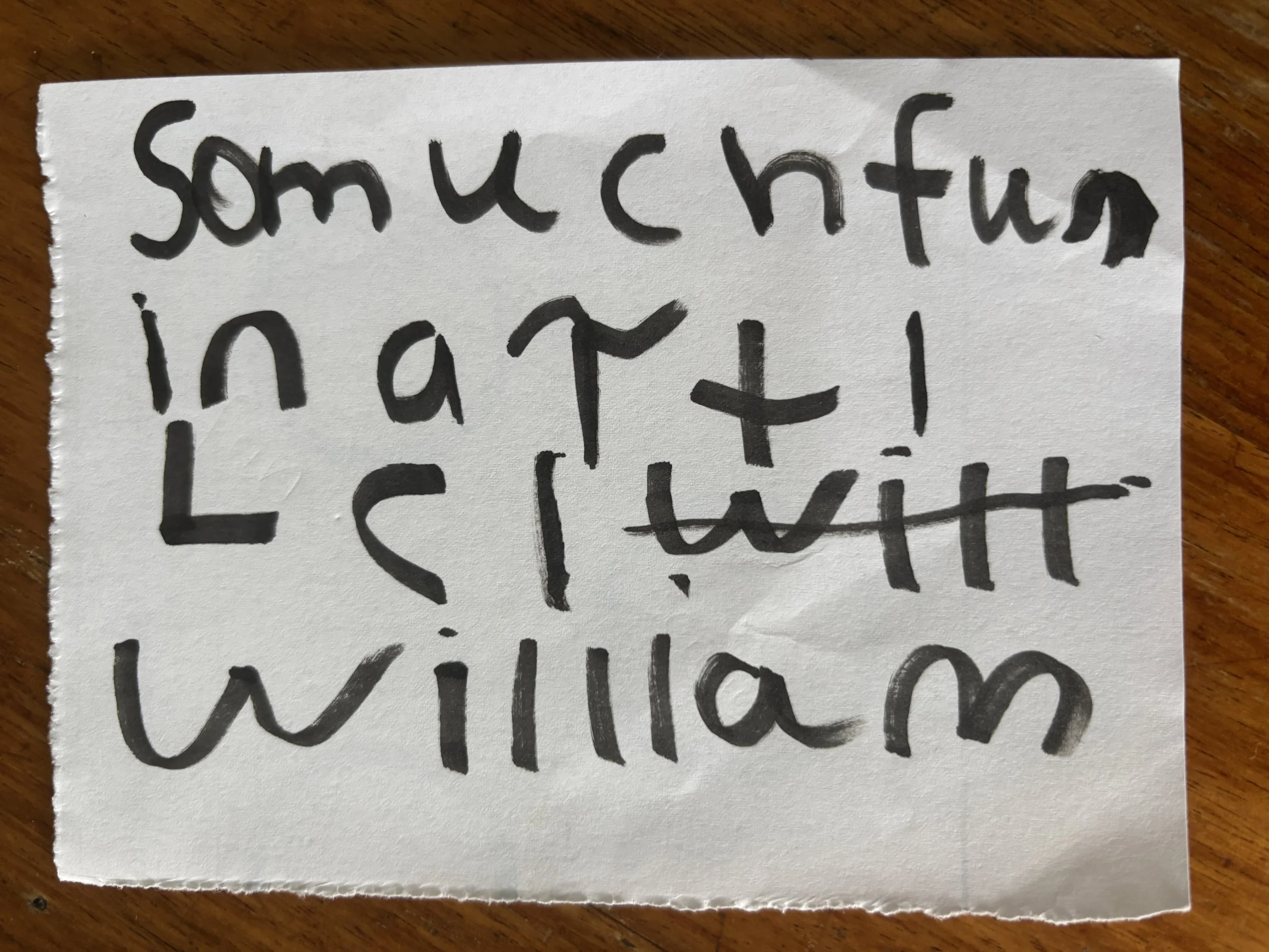 Handwritten note on white paper that says, 'Smuchfun in art! Let's twill William.'