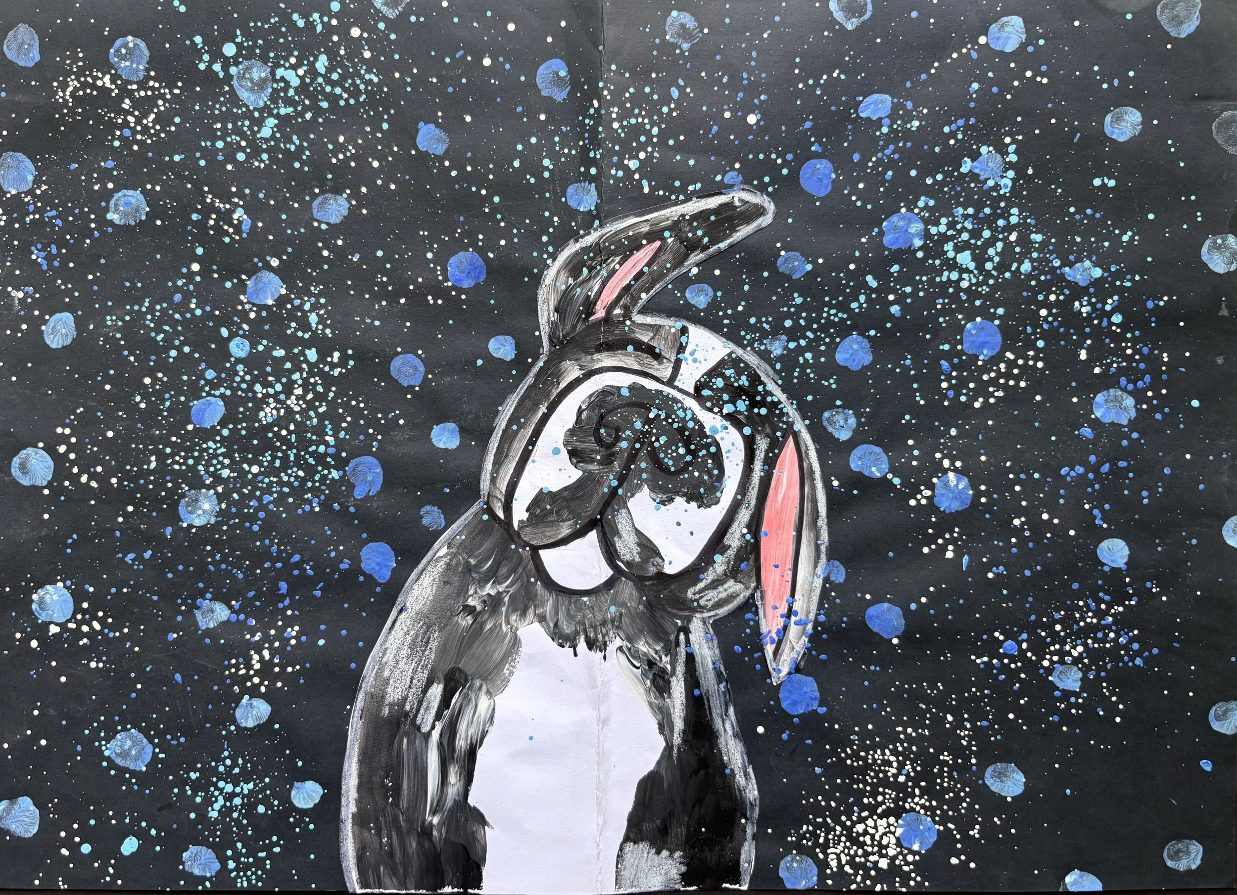 Painting of a penguin with a cosmic background of black with blue and white splatters resembling stars and space.