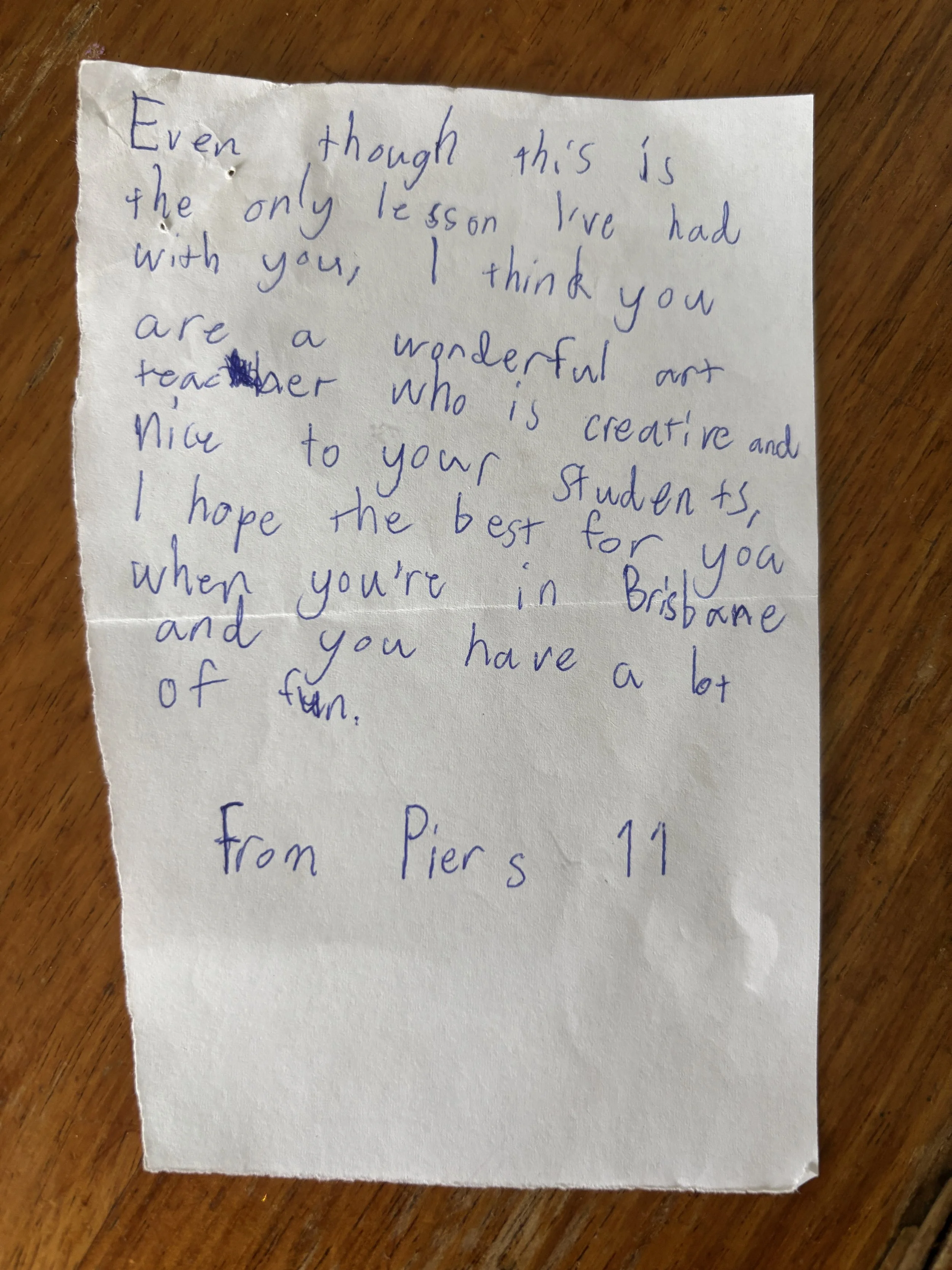 Handwritten letter on torn piece of paper with a note expressing appreciation and good wishes, signed by Pier 11.