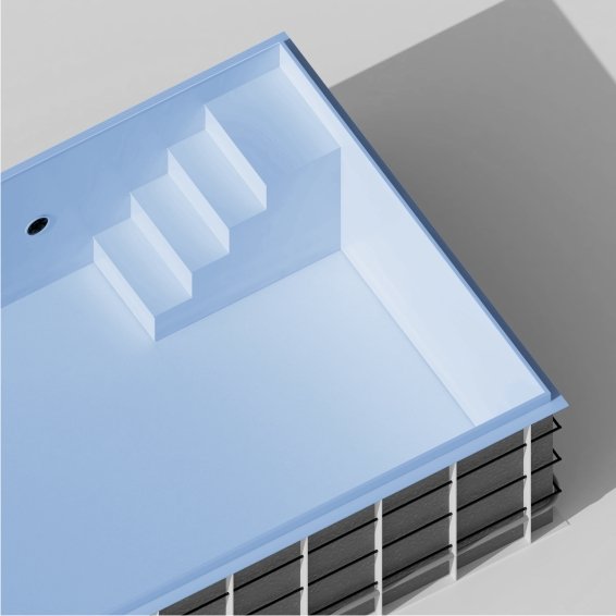 A partly built swimming pool with three built-in steps and a hole for a drain, showing a modern, minimalist design.