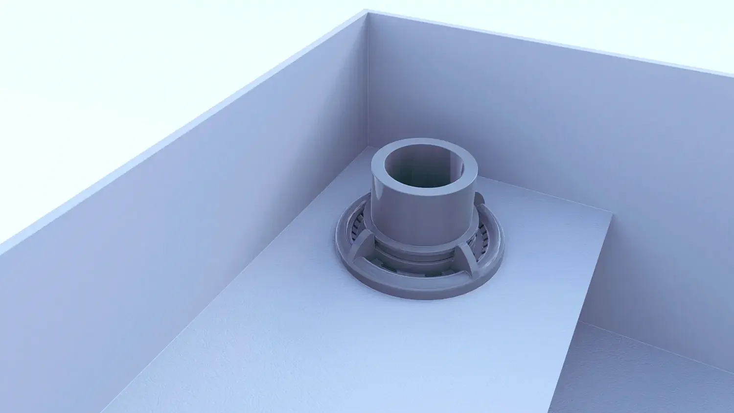 Close-up of a modern kitchen stove burner with a gray circular grate and a central cylindrical component on a white countertop.