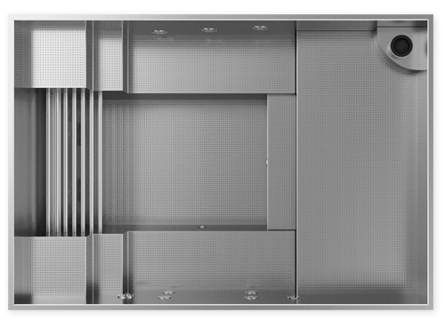 Empty metal storage or organizational tray with various compartments and slots