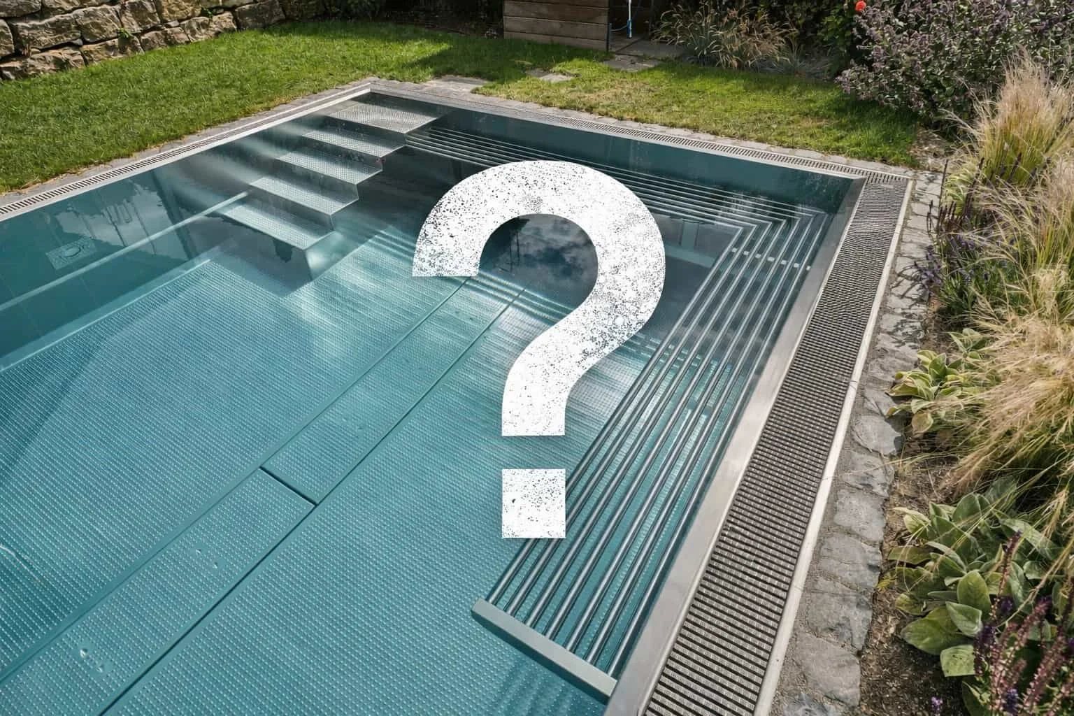 A modern backyard swimming pool with metal steps and a partially covered bottom, surrounded by grass, plants, and stone paving, with a large white question mark in the center.