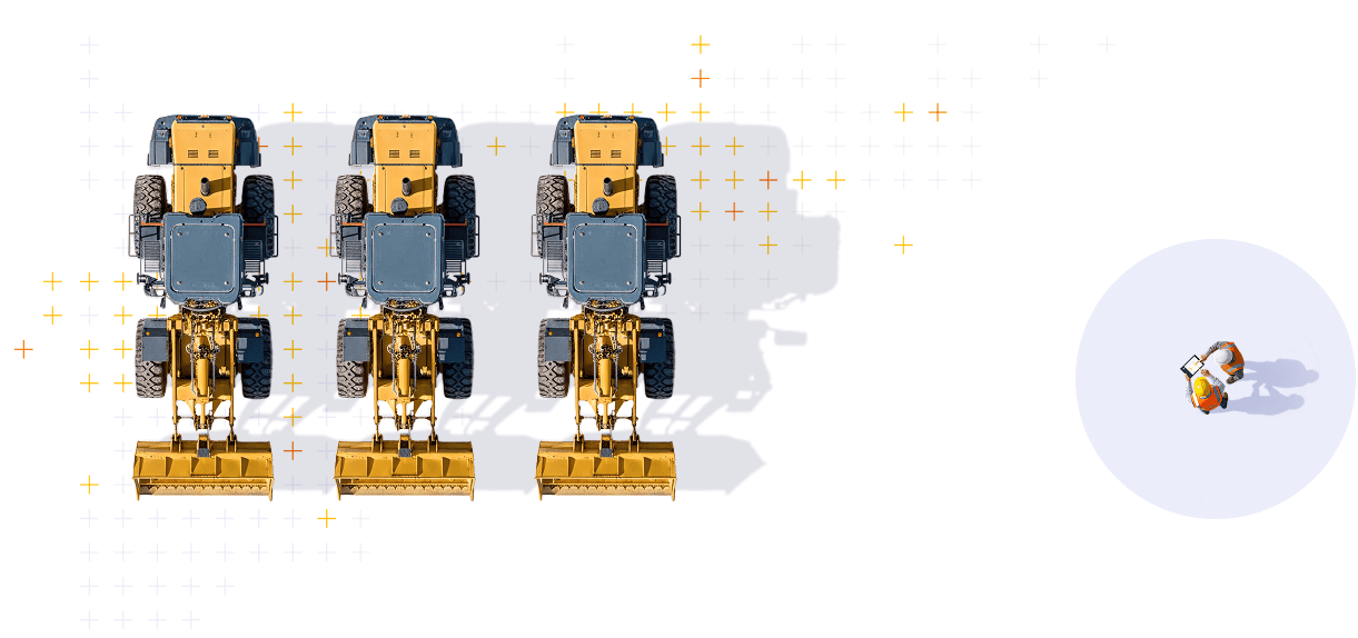 Trois véhicules de construction alignés avec un mini-excavateur à l'avant, vu d'en haut, avec deux personnes debout dans une zone éclairée sur le côté droit.