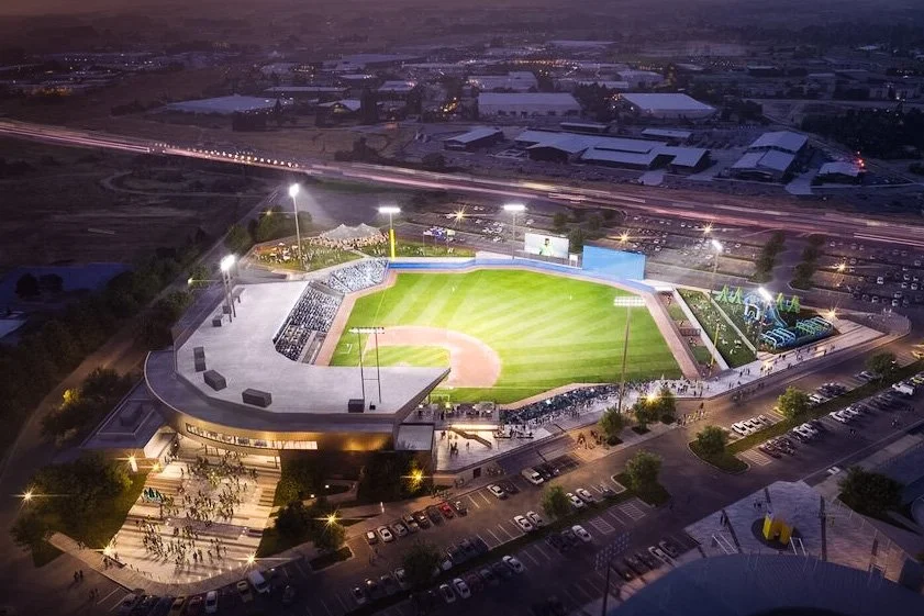 Completed Hillsboro Hops stadium at evening with bright stadium lighting, bringing people together for a game, family time, and lasting memories.