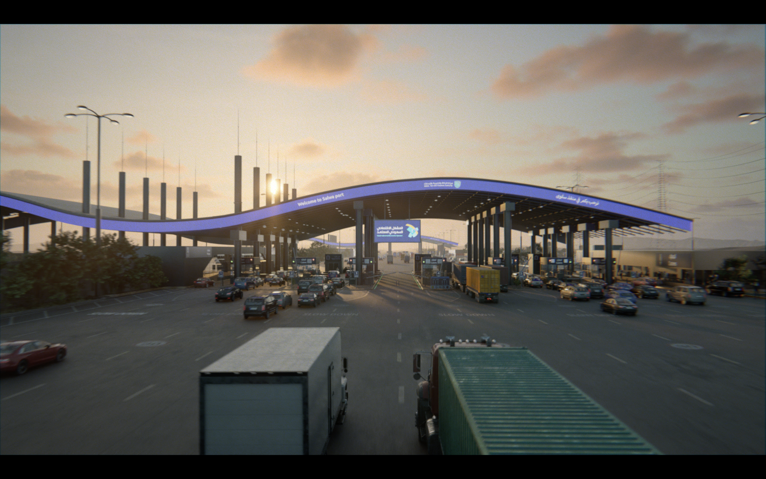 Entrance of Salwa port with multiple cars and trucks passing through toll booths under a curved canopy with digital signs, during sunset with a partly cloudy sky.