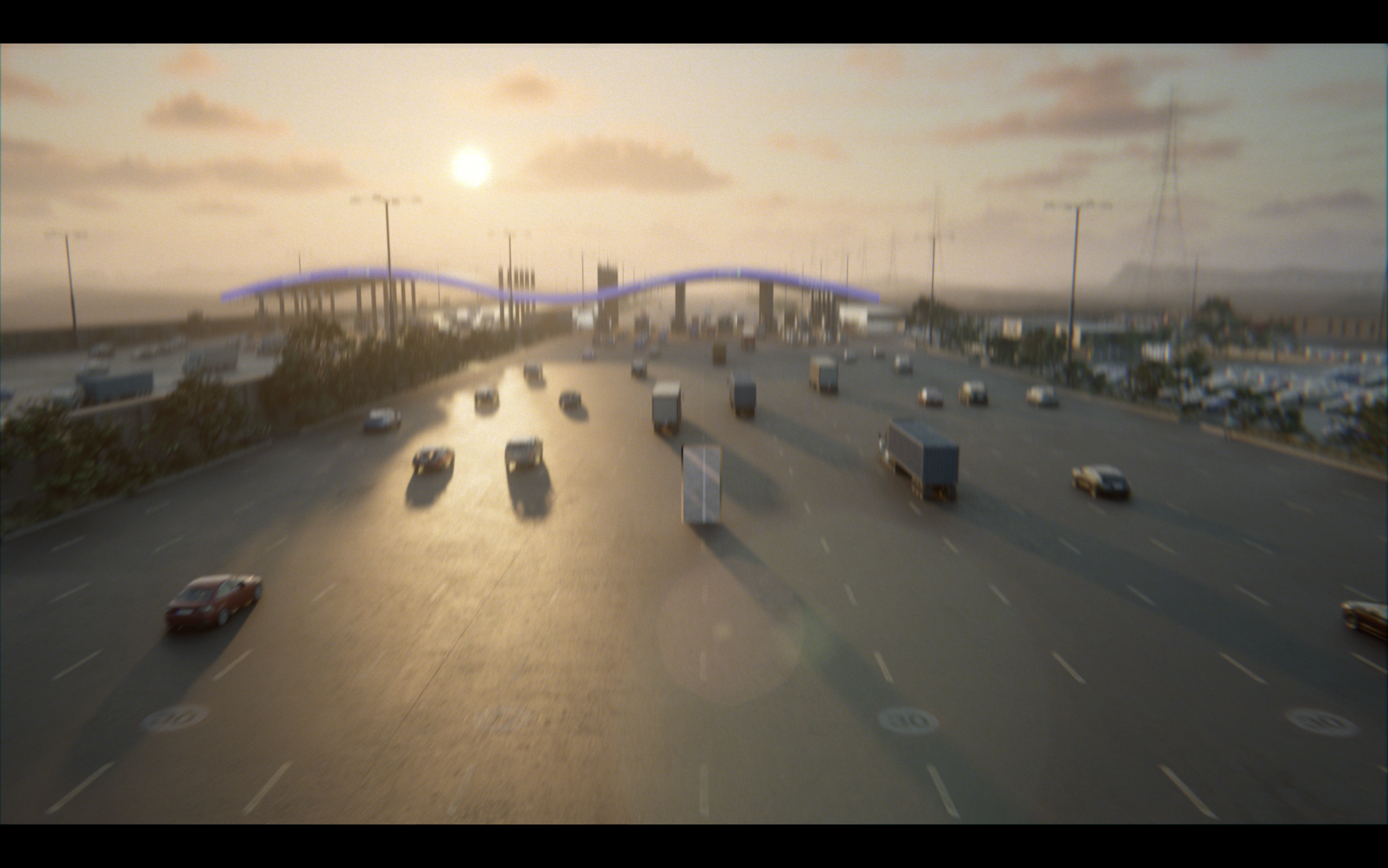 Highway with multiple vehicles including trucks and cars during sunset, with an overpass bridge in the background.