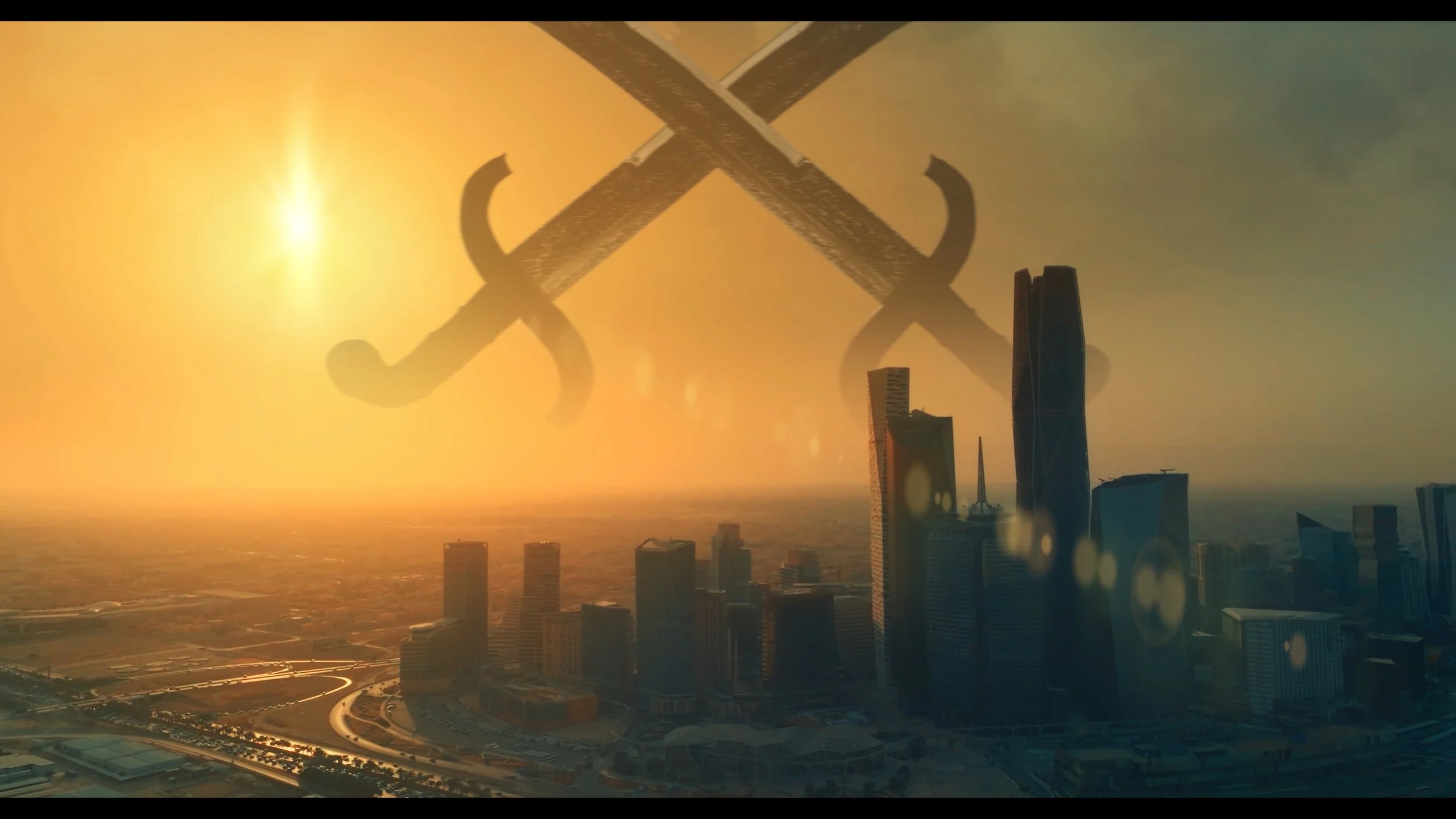 A city skyline at sunset with tall buildings and a large set of crossed swords flying overhead.