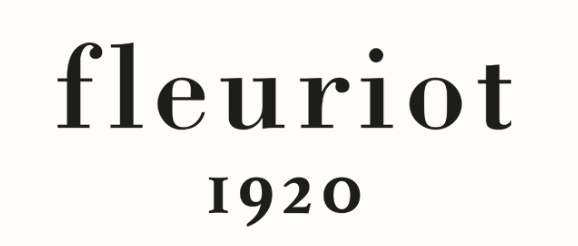 Close-up of a label with the text 'fleurit' and the year '1920' in black font on a white background.