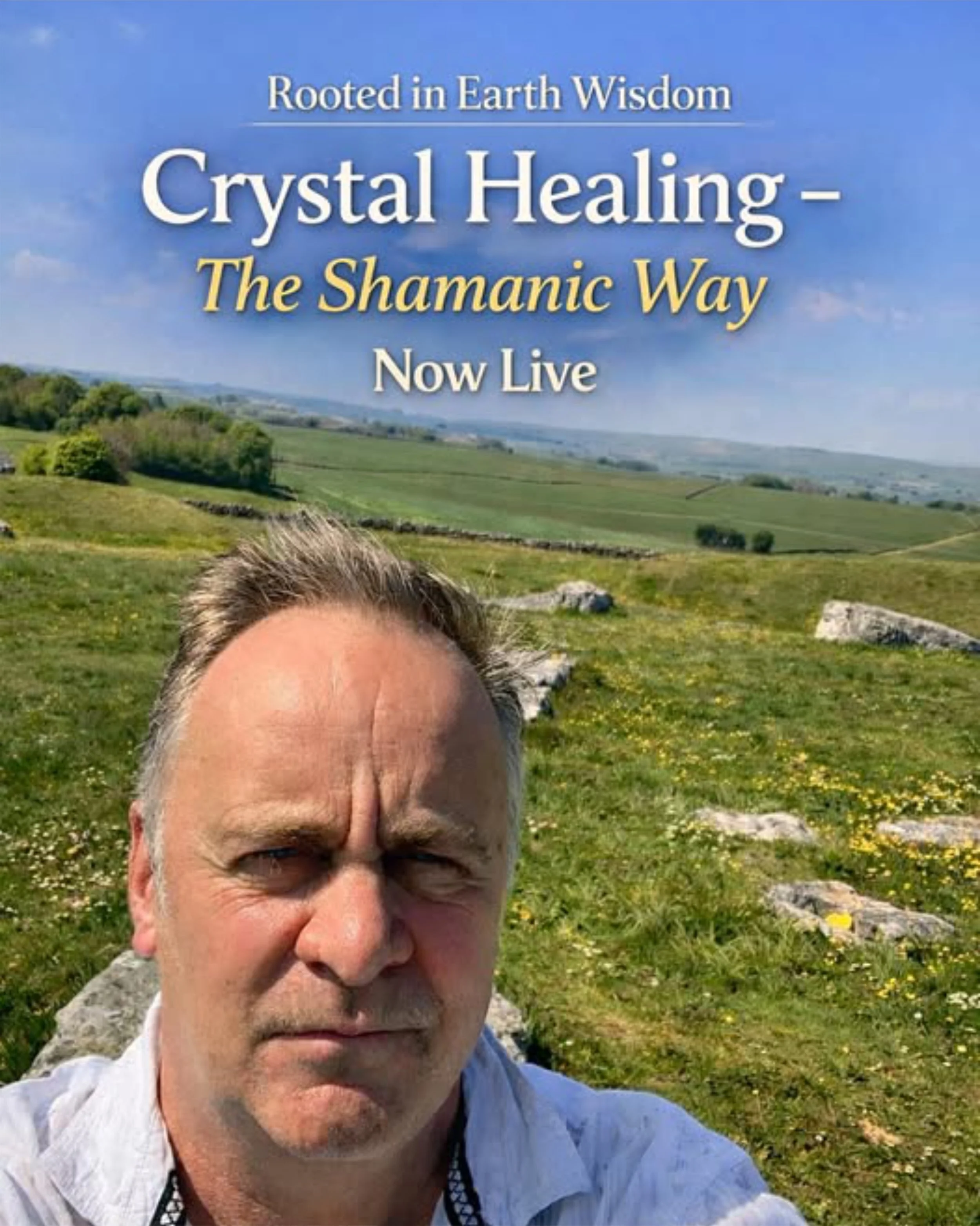 Partial portrait of a man with gray hair and glasses, outdoors in a grassy field with hills and scattered trees, and a sign in the background that reads: "Rooted in Earth Wisdom, Crystal Healing - The Shamanic Way, Now Live."
