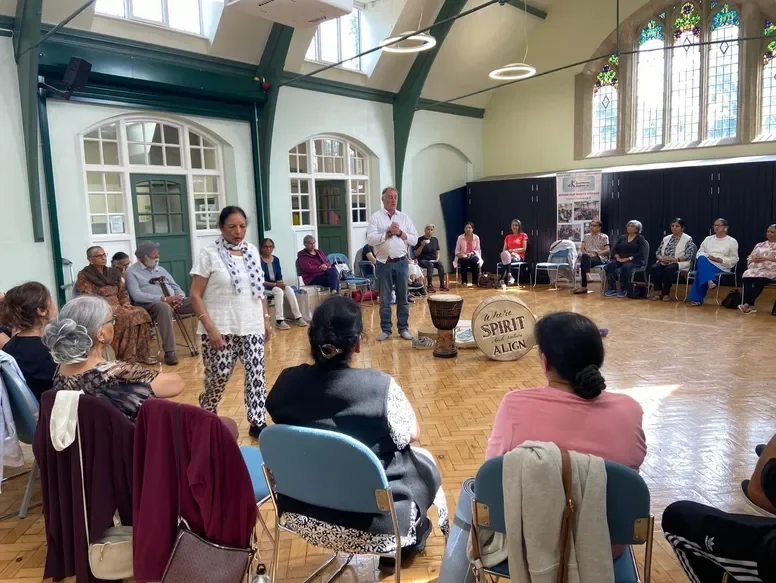 Andrew Elson speaking at an event