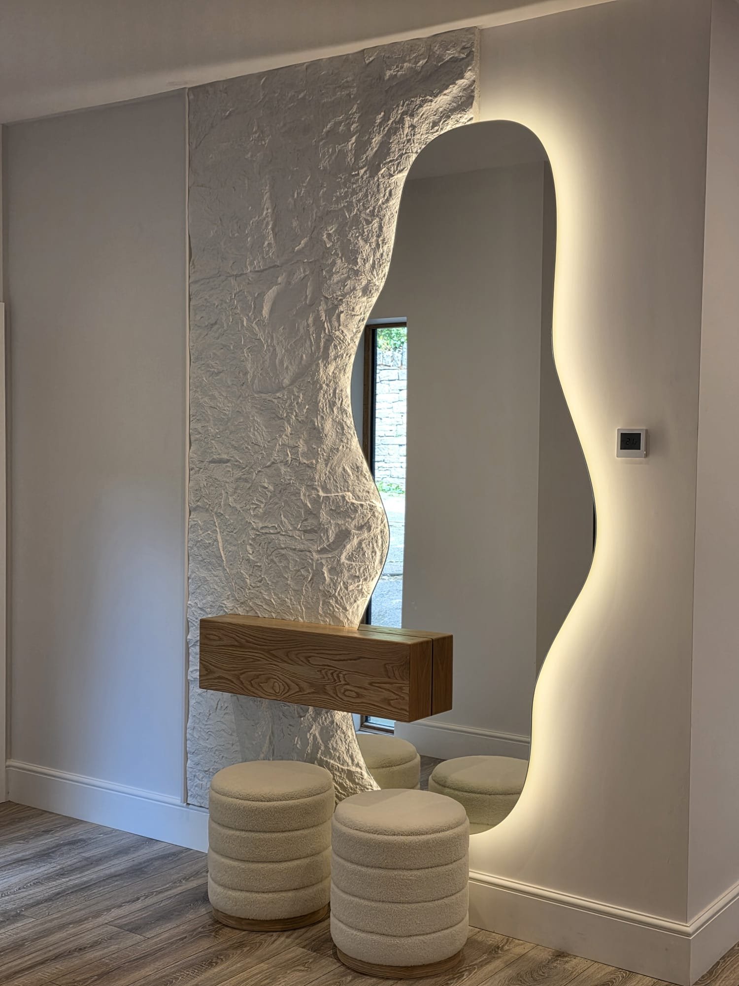 Monolith bespoke sculptural mirror with floating oak shelf and textured wall feature installed by BCreative Bespoke