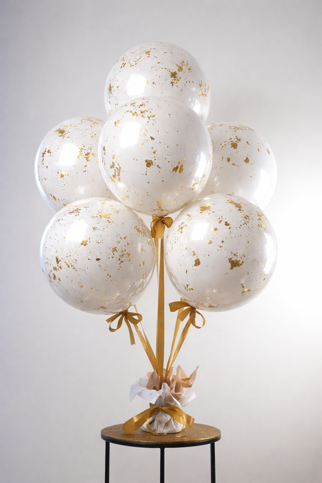 Elegant white and gold balloon bouquet.png