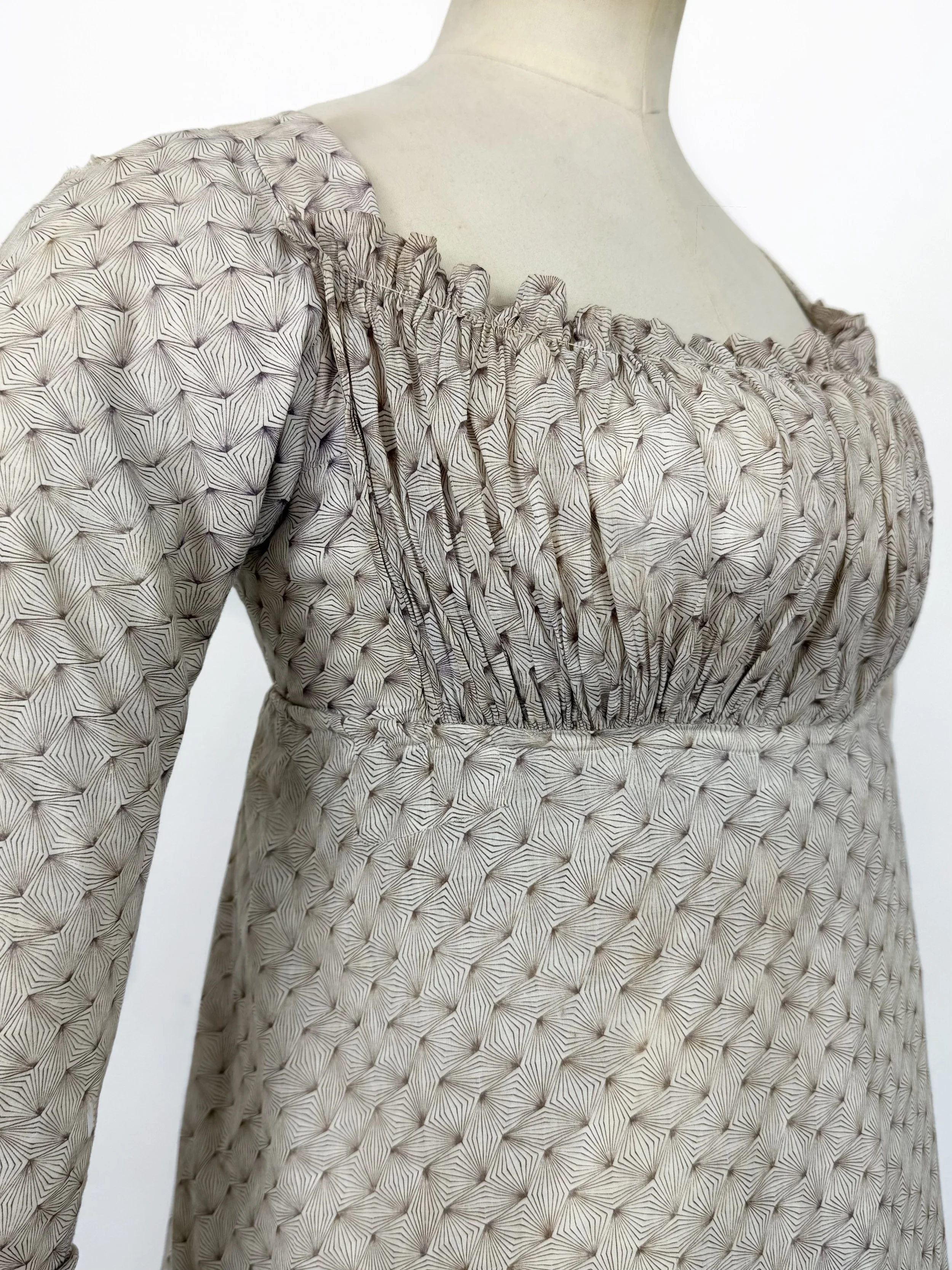 Roller printed bib front gown circa 1810