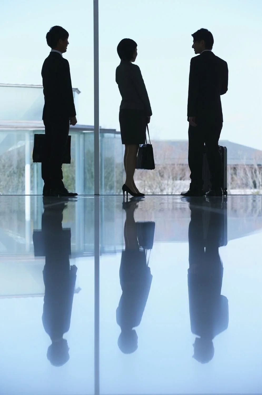 A group of three accountants discussing in AxeFi's headquarters.