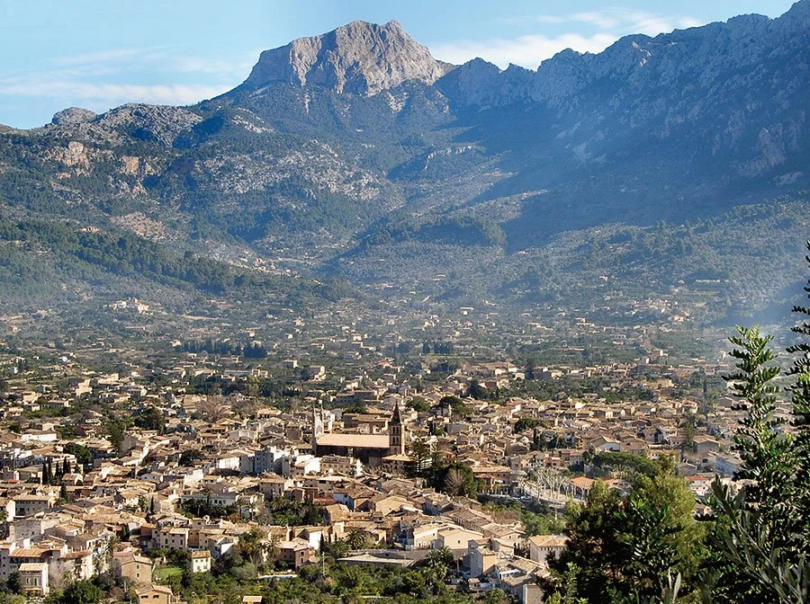 The valley of Sóller, Mallorca with the Serra de Tramuntana mountains and traditional stone village