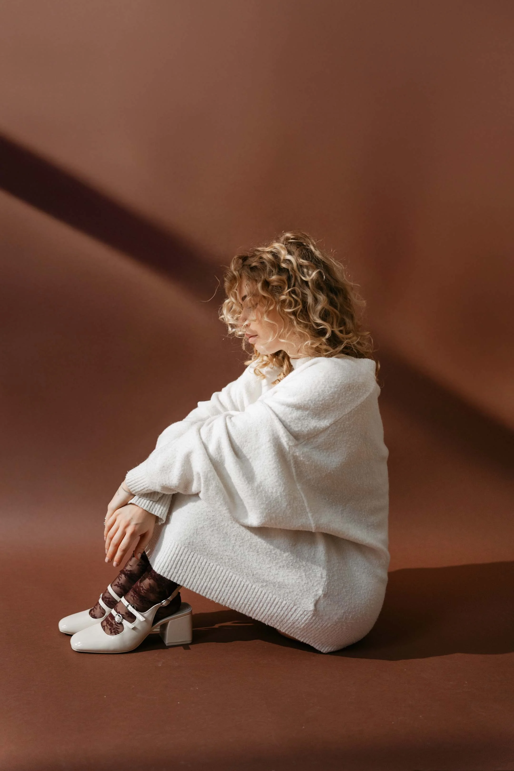 Fashion and jewelry editorial shoot with refined studio lighting