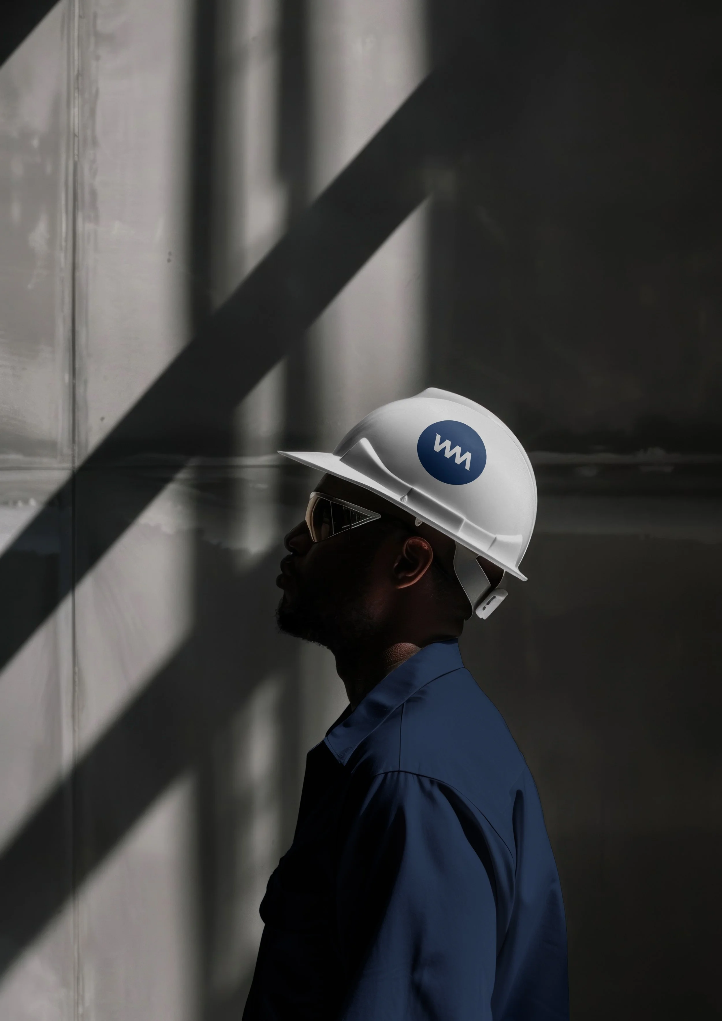An image of work wearing WellMark logo icon hardhat.