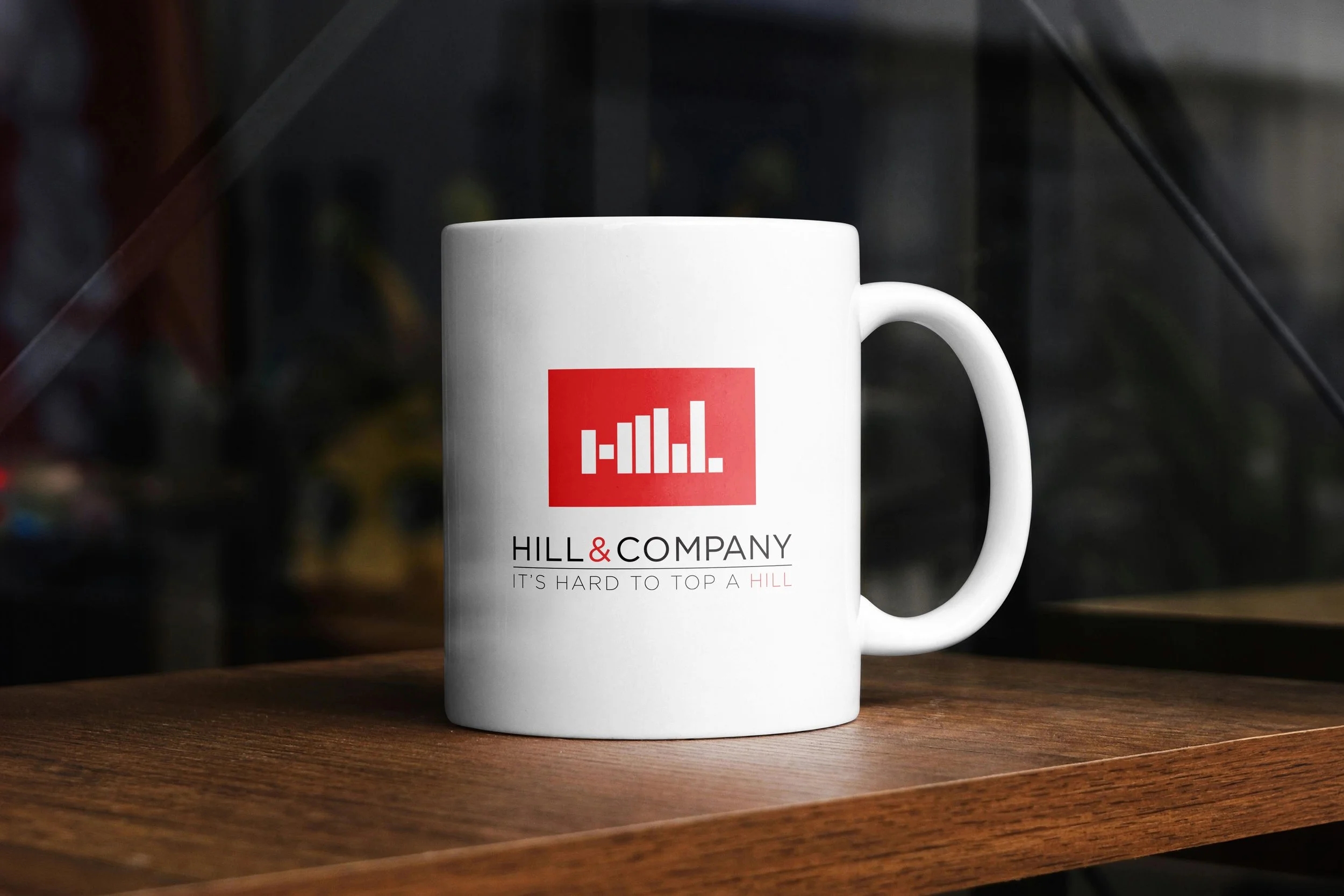 An image of Hill & Company rebrand coffee mug.