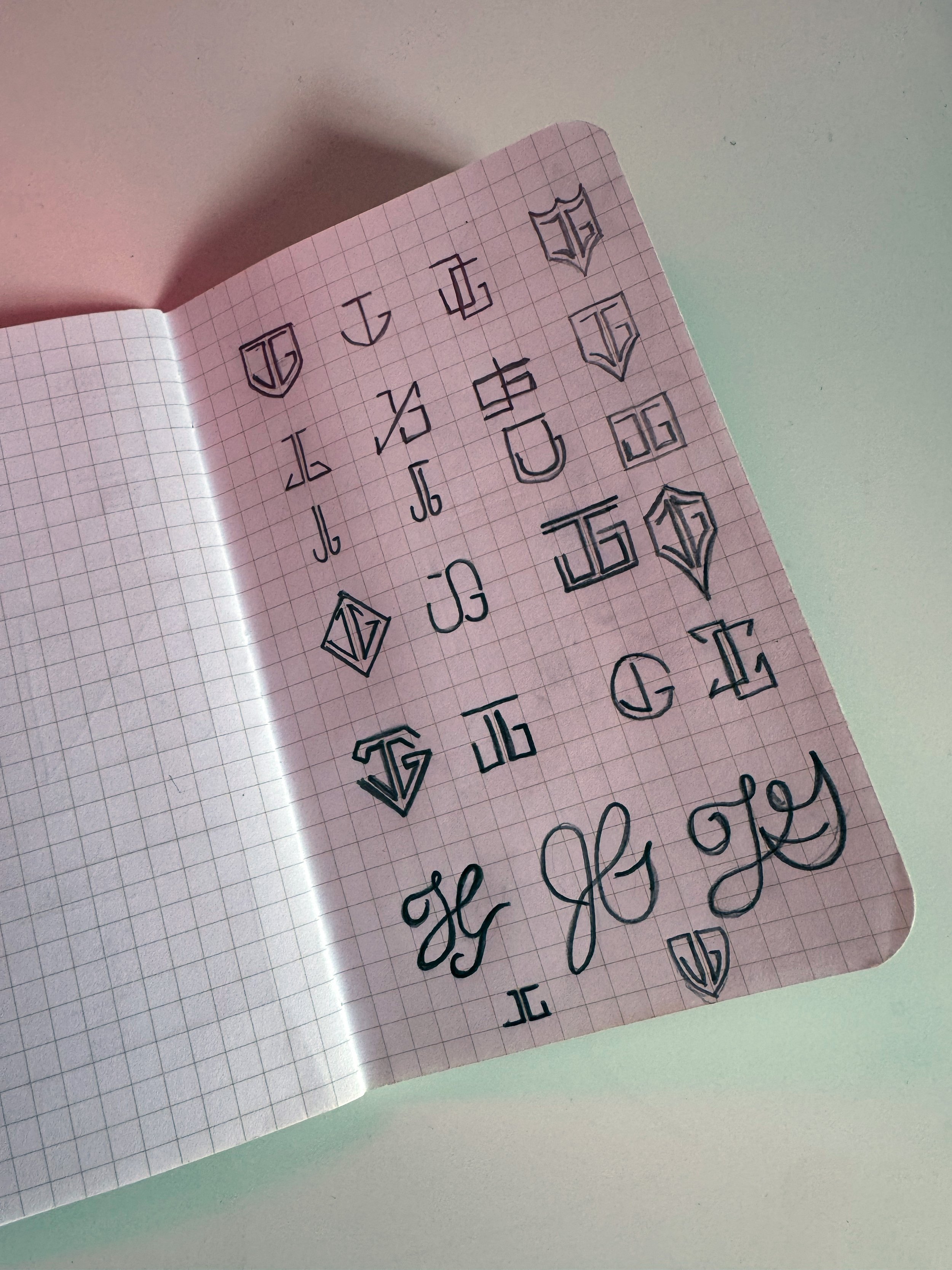 An image of J Gard LLC rebrand sketches.