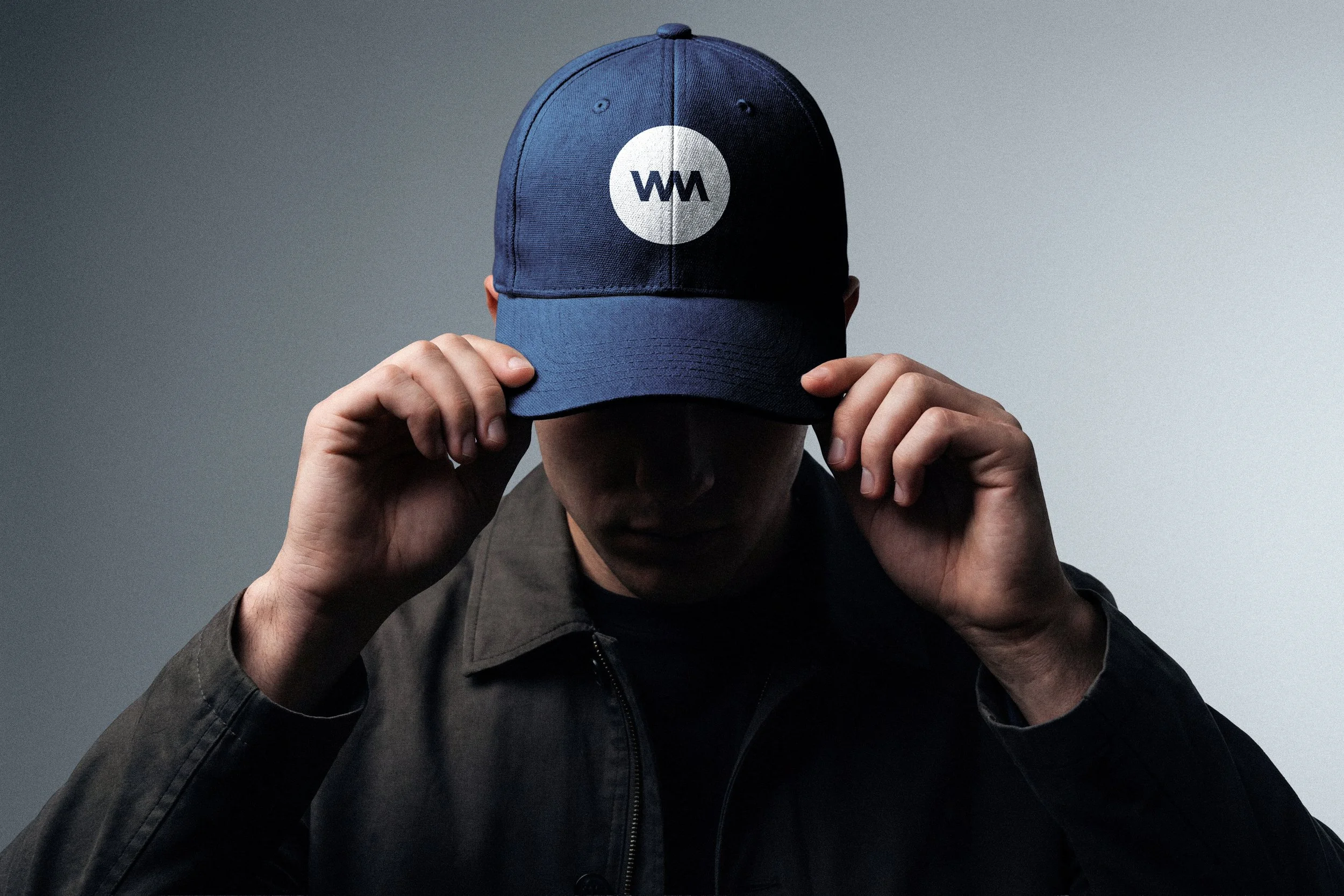 An image of a guy wearing WellMark logo icon baseball cap.