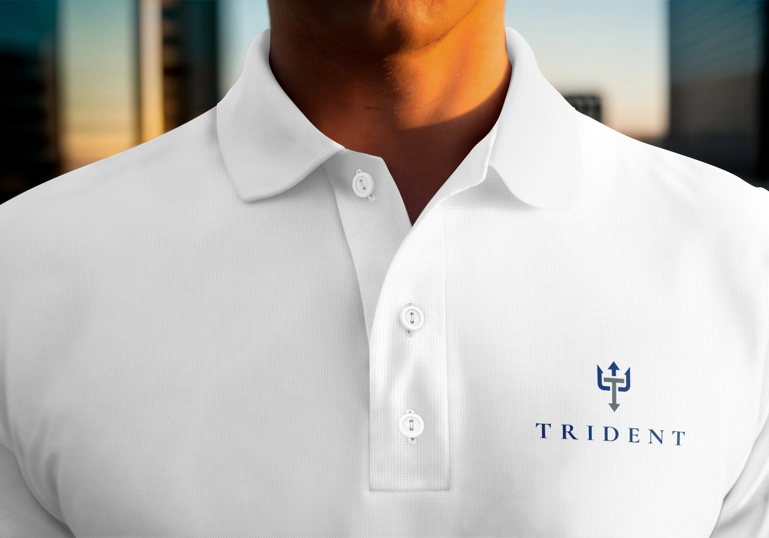 A guy wearing Trident Marine Industry Plastics logo polo.