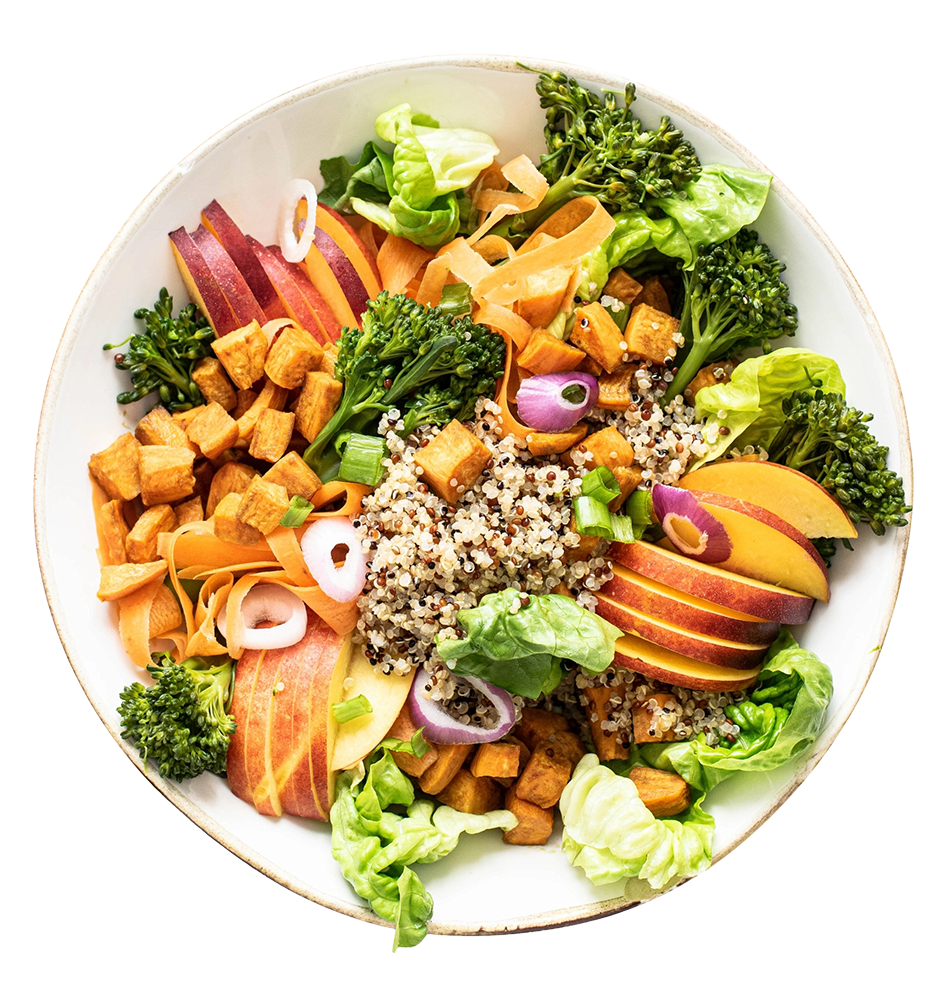 A bowl of mixed salad with quinoa, apples, broccoli, carrots, radishes, lettuce, and croutons.