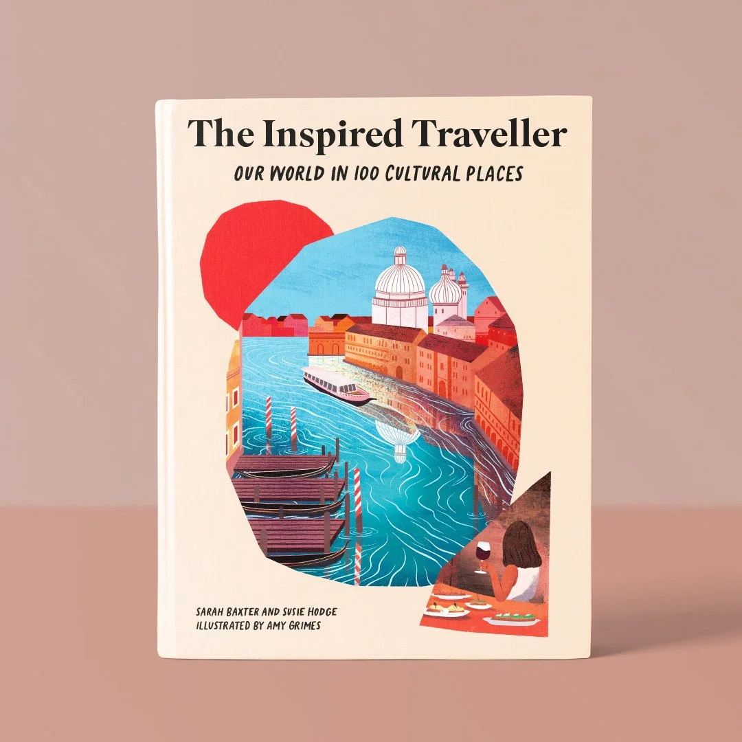 Book titled "The Inspired Traveller: Our World in 100 Cultural Places" by Sarah Baxter and Susie Hodge, illustrated by Amy Grimes, featuring an illustrated cityscape with water, boats, and a person dining.
