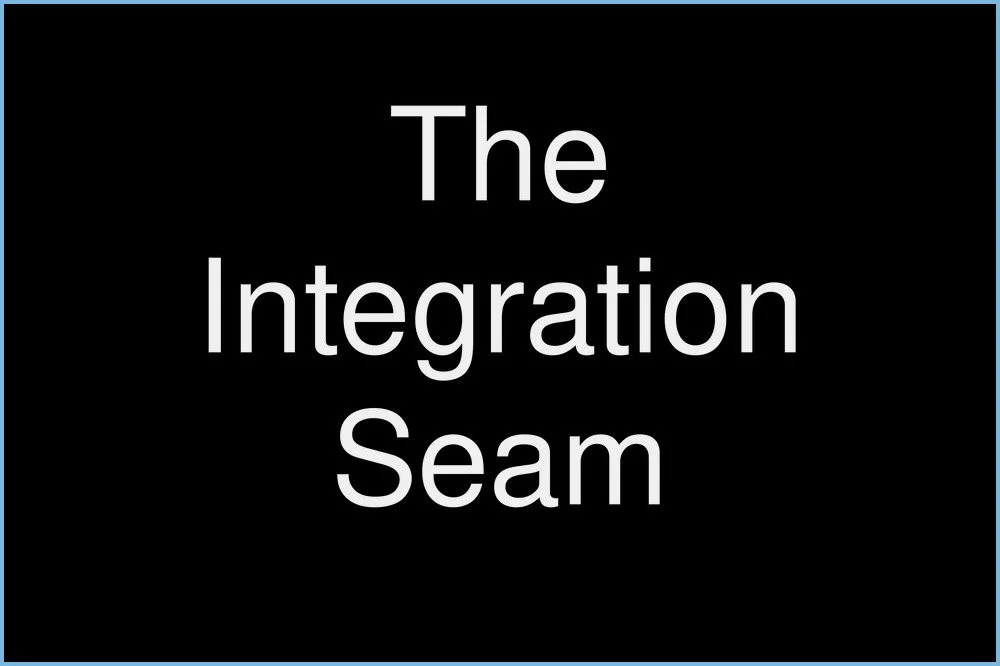 Text on a black background reading "The Integration Seam."