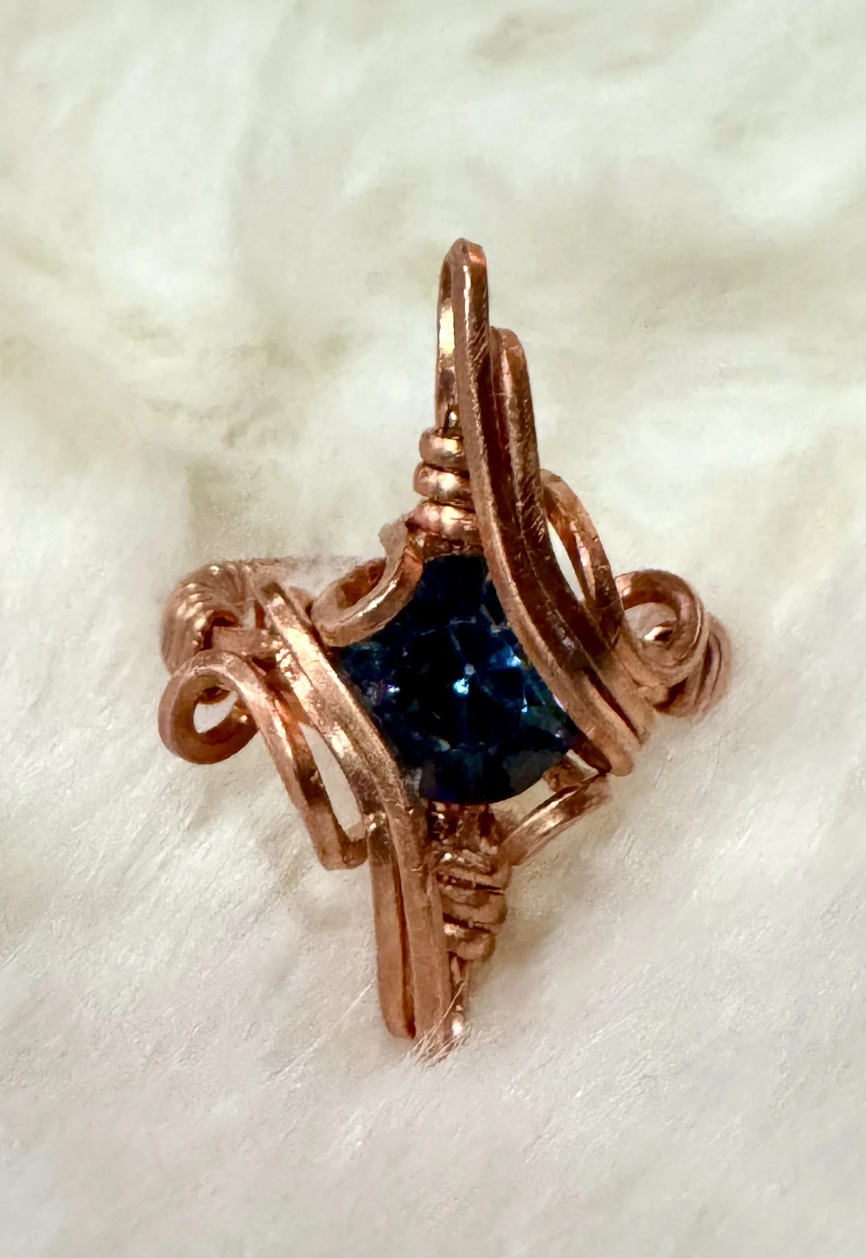 Faceted blue stone ring in copper