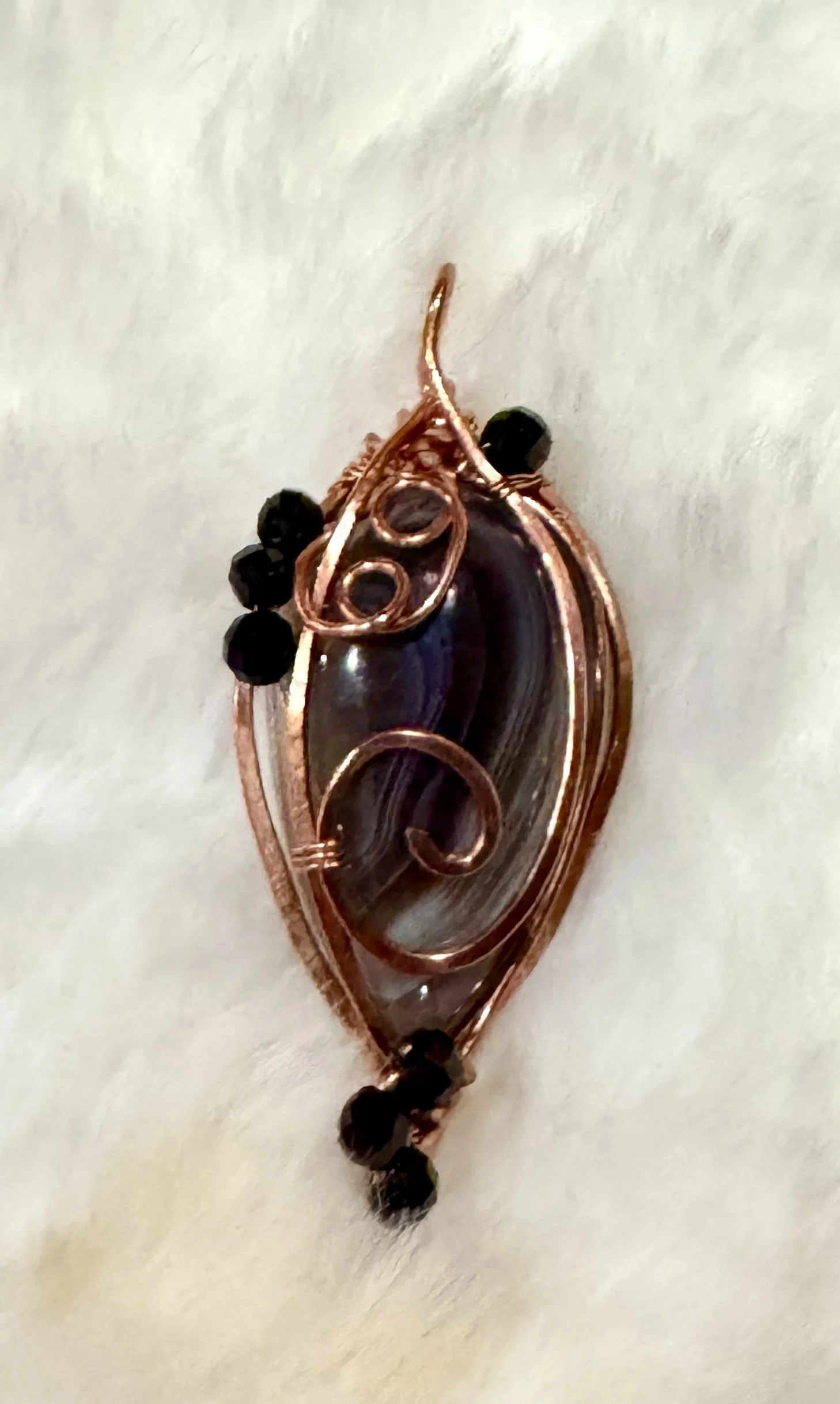 Botswana Agate with garnet accents wrapped in copper