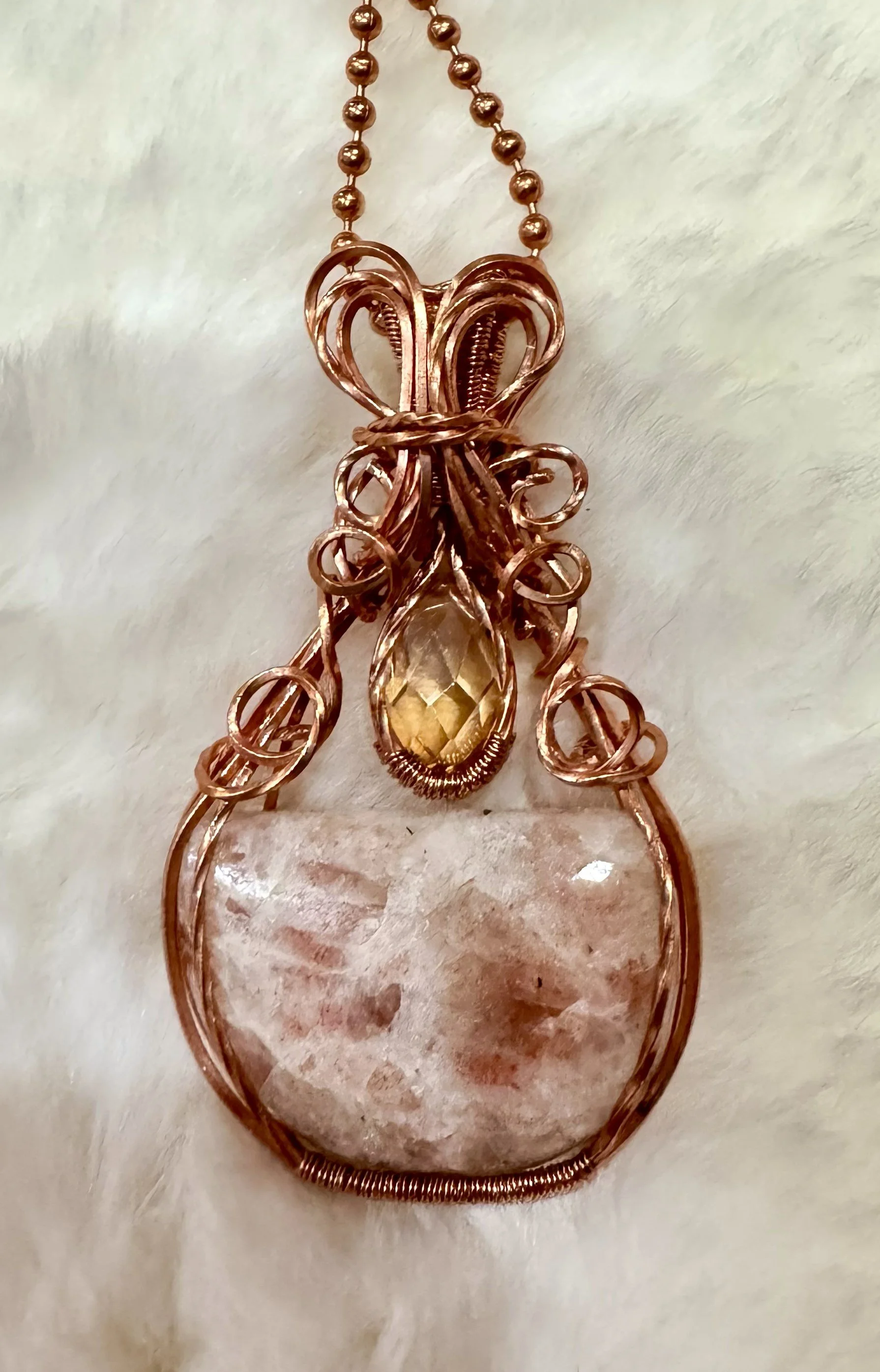 Peach Feldspar wrapped in copper wire