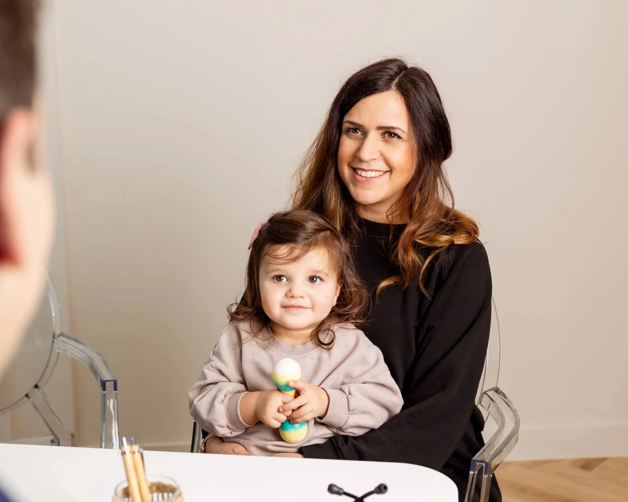 Young girl and mum at private GP consultation