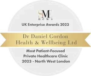 Award badge for UK Enterprise Awards 2023, presented to Dr. Daniel Gordon of Health & Wellbeing Ltd for Most Patient-Focused Private Healthcare Clinic in North West London.