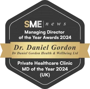 A badge or certificate design indicating Dr. Daniel Gordon as the Managing Director of the Year Awards 2024 in the SME news category, recognizing private healthcare clinic MD of the Year 2024 in the UK.