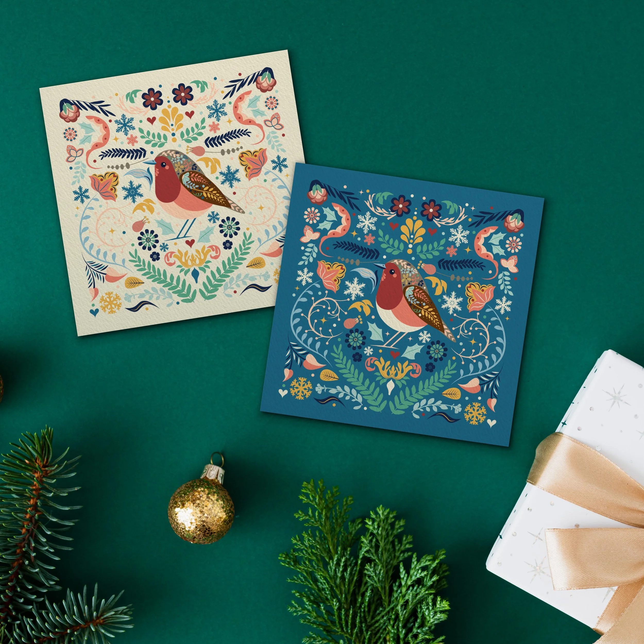 2 christmas cards featuring bright illustrated robin with floral patterned background
