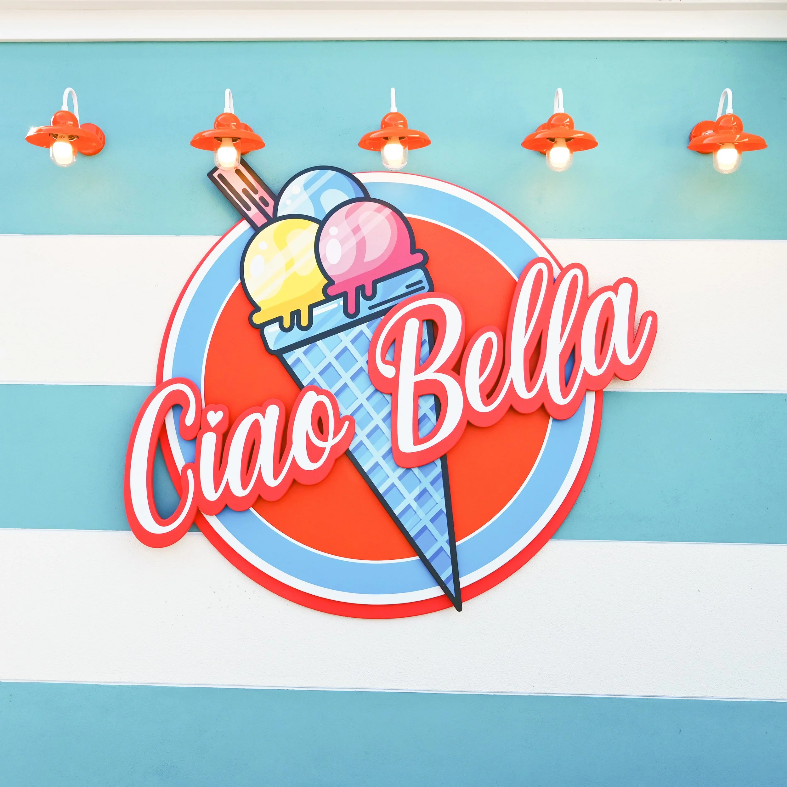 logo sign for Paultons Park's Italian gelato ice cream themed for kiosk Ciao Bella featuring decorative lettering and ice cream illustration