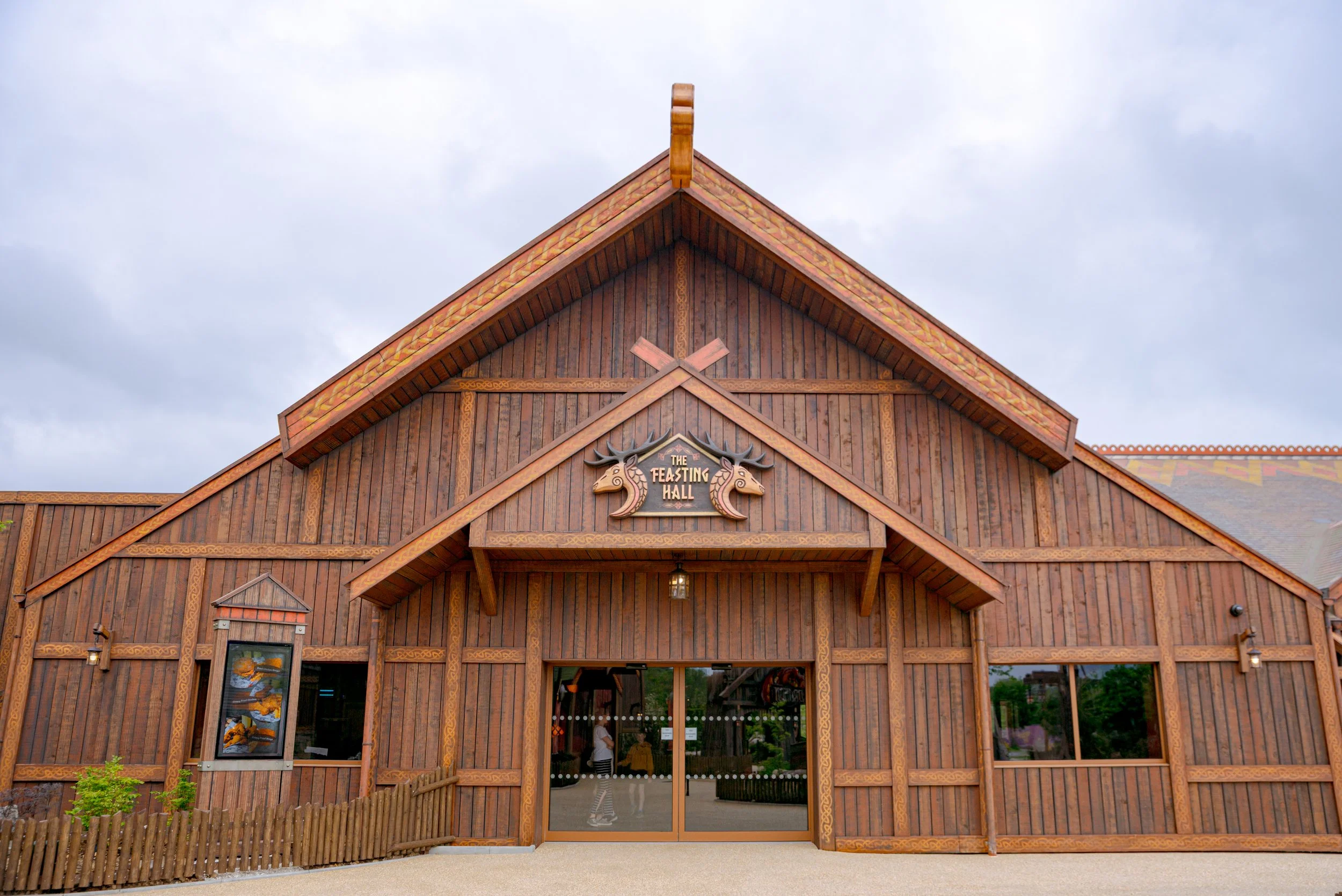 The Feasting Hall building in Valgard at Paultons Park featuring the Viking style logo with 2 deer